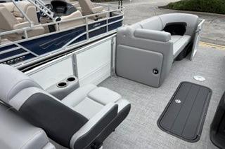 2026 Sun Tracker Party Barge 22 XP3 interior with gray seating and deck.