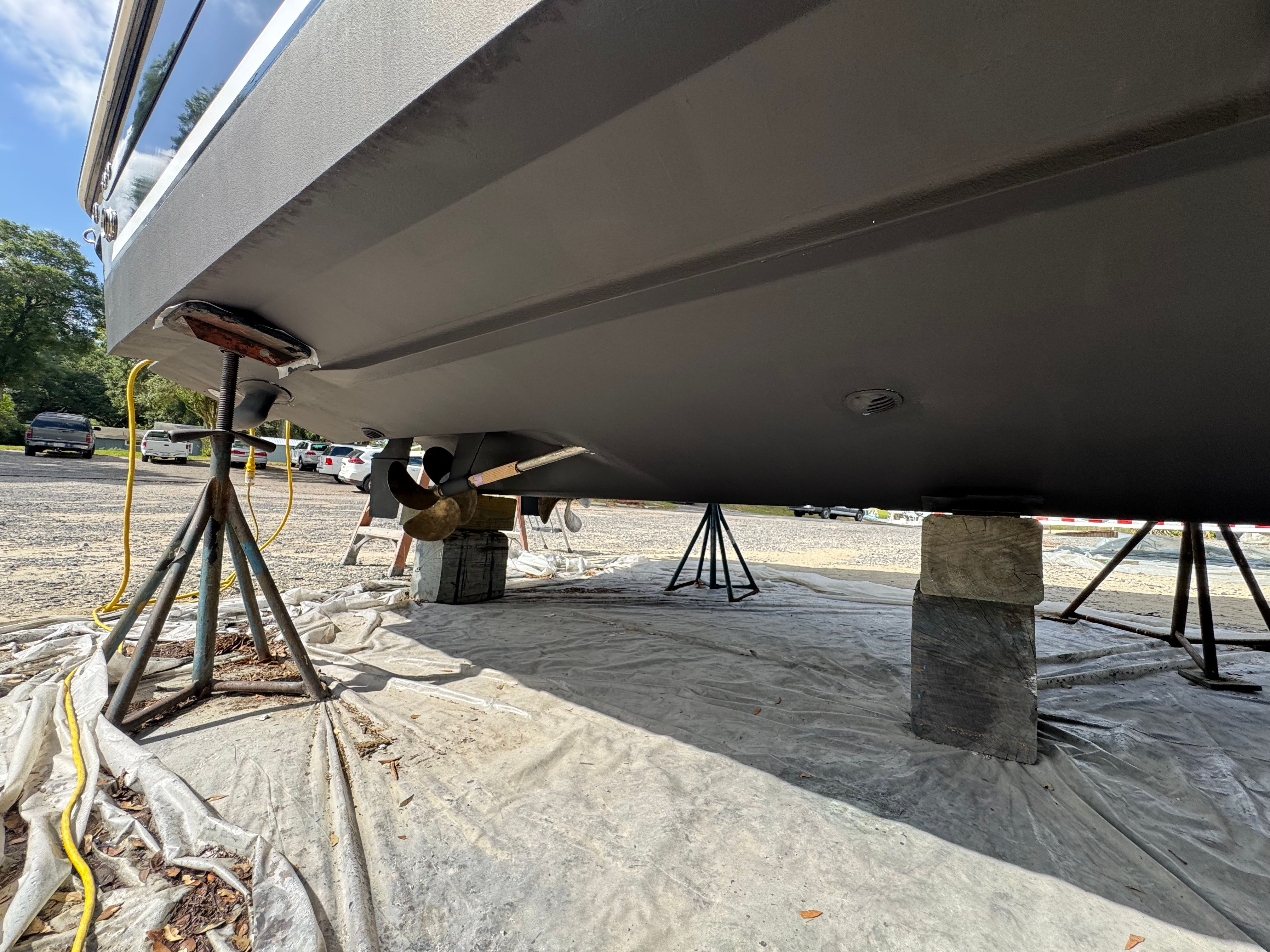 Underside of a 2007 Sea Ray Sundancer 310 yacht on stands.