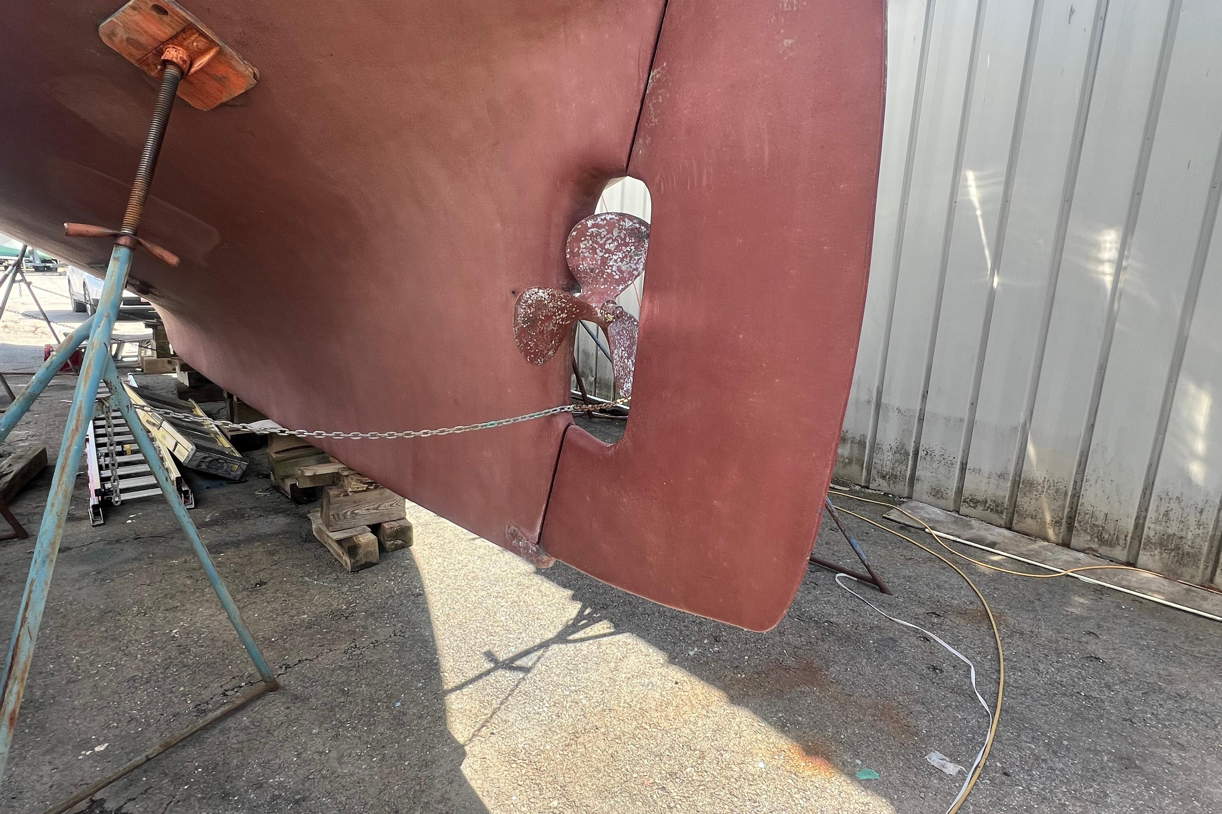 Bottom view of a 1983 Durbeck 50 sailboat with visible propeller and rudder.