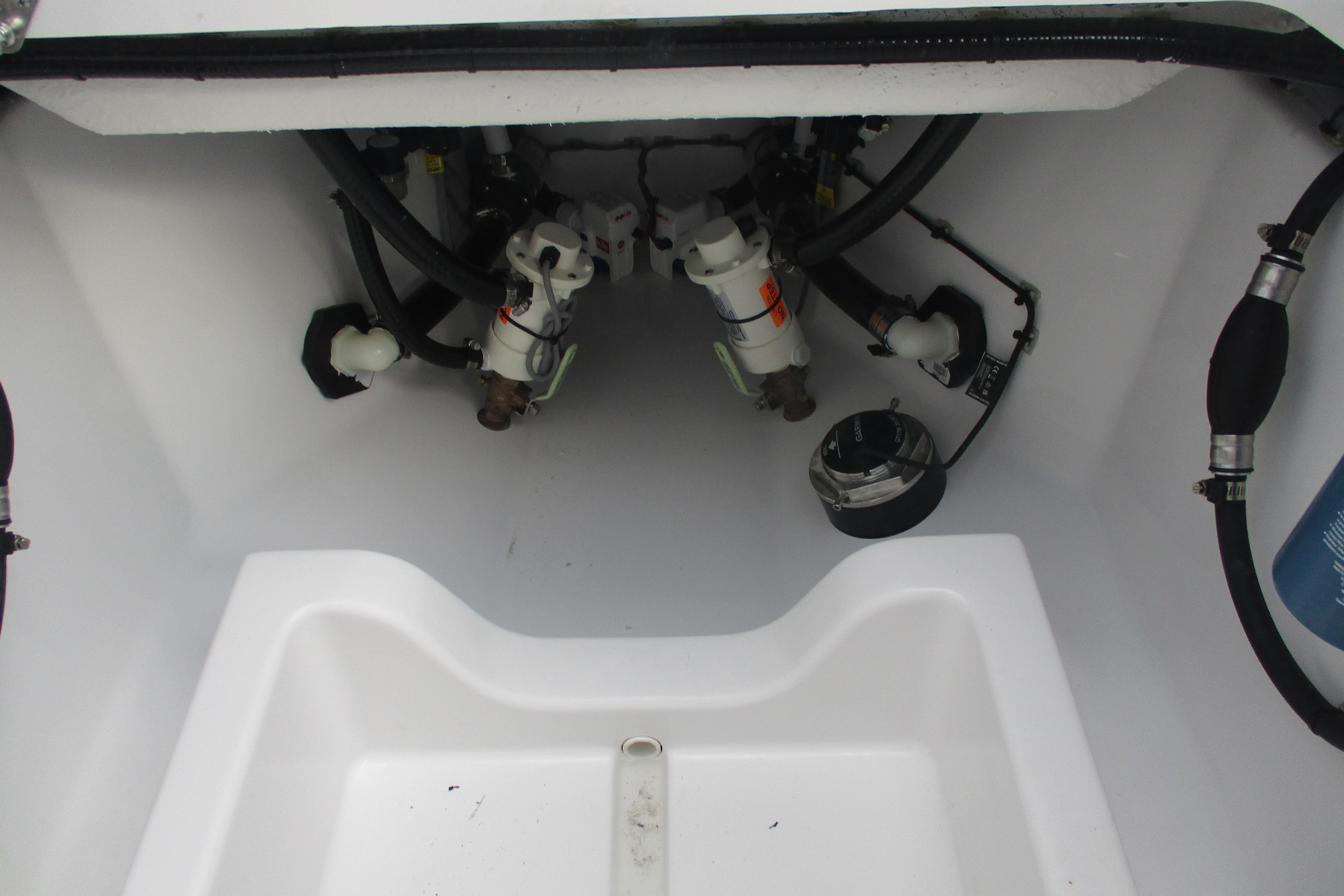 2026 Sportsman Open 302 Center Console boat interior, showcasing mechanical components and wiring.