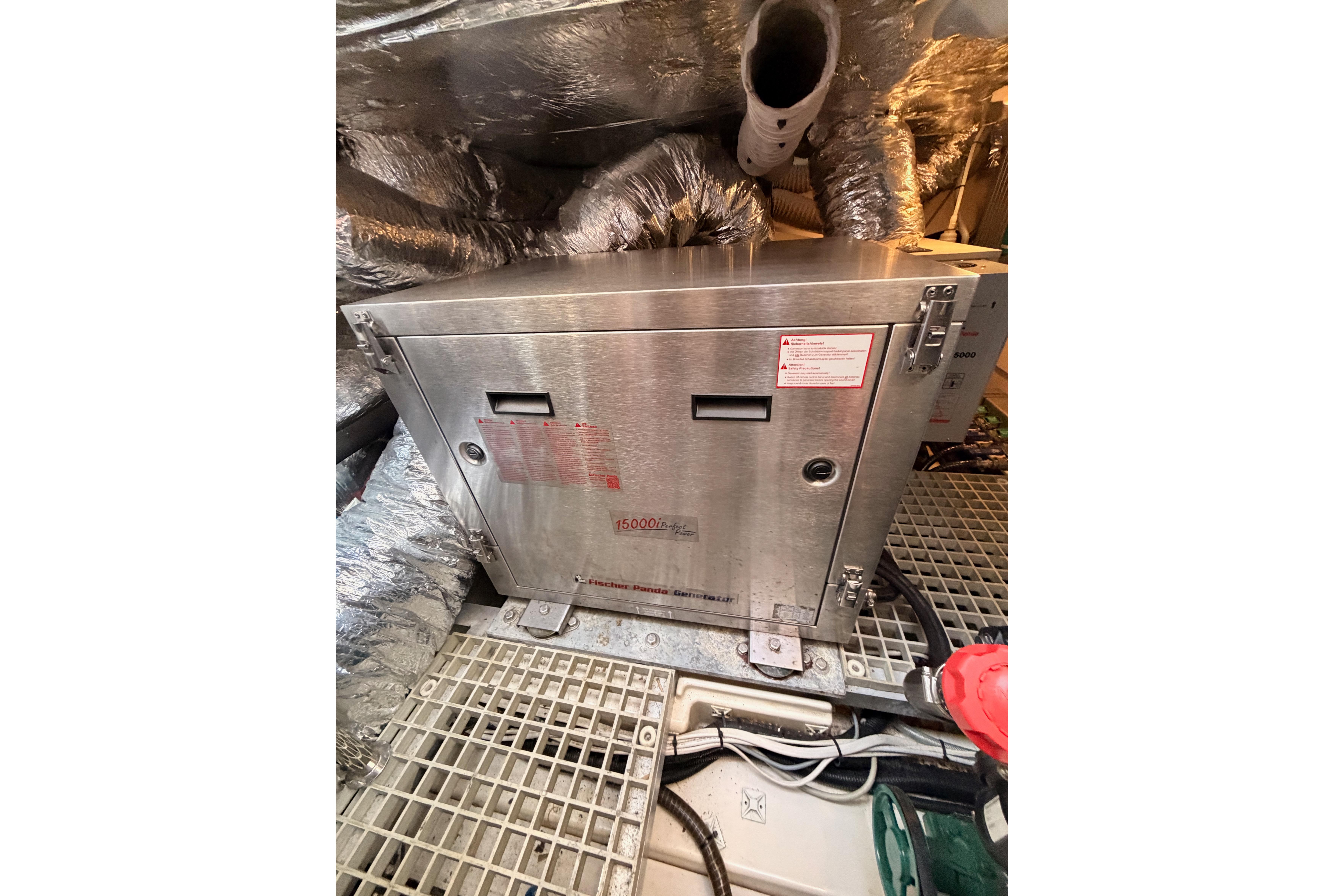 Engine room of 2016 Moody Decksaloon 54 yacht with machinery and ductwork.