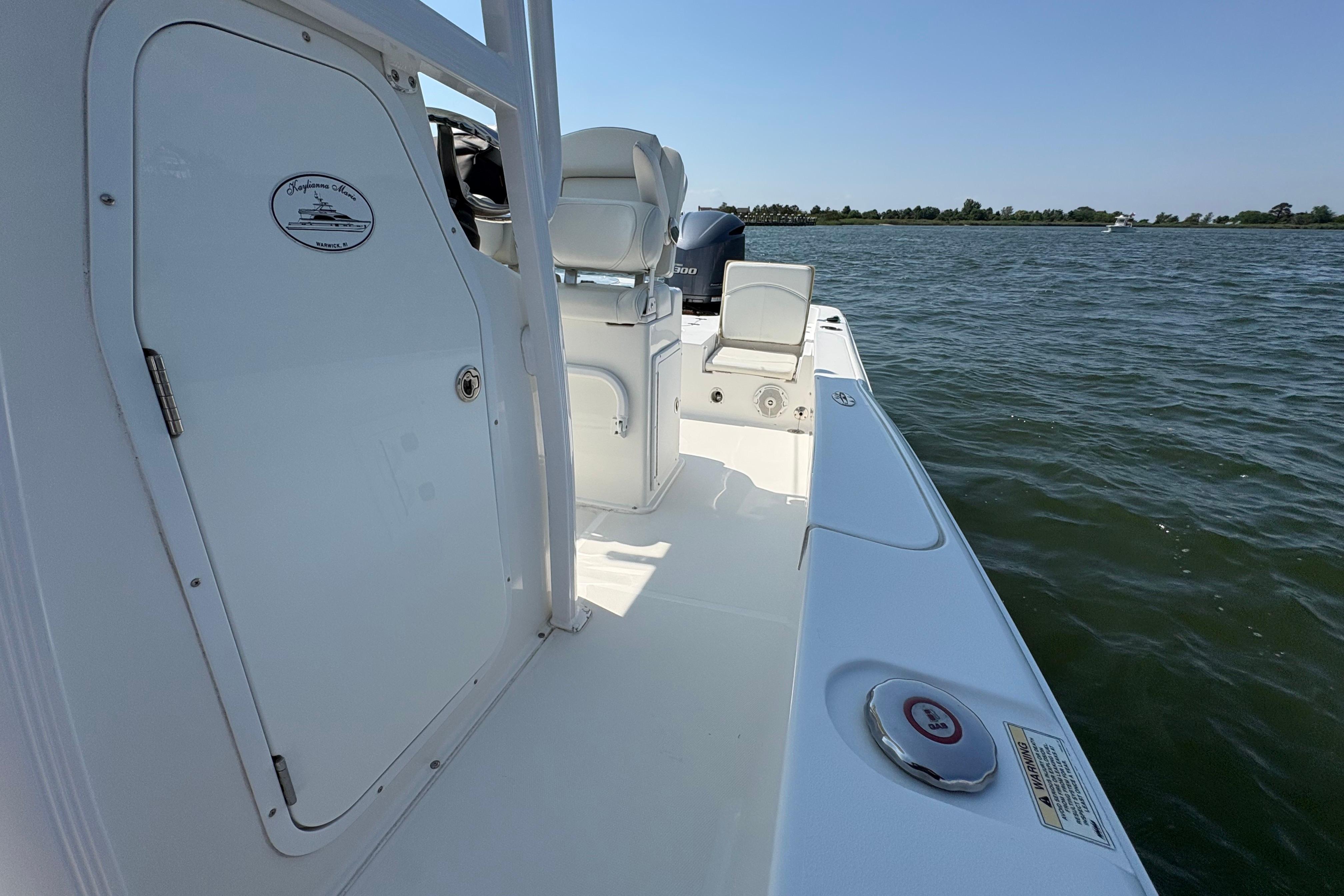 2017 Sea Hunt BX 25 BR boat on water, showcasing deck and seating area.
