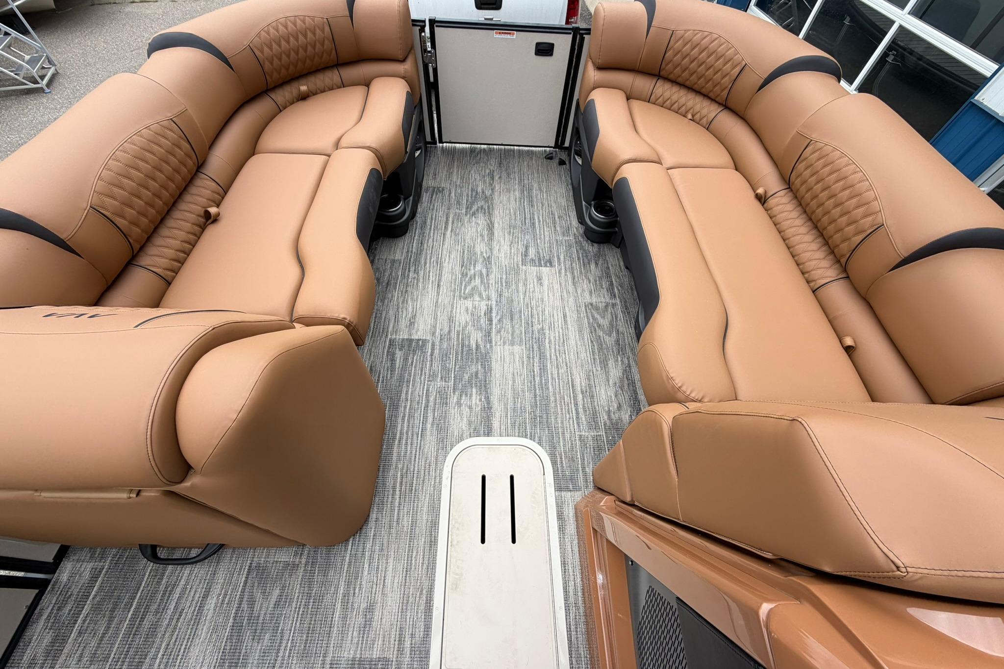 Luxurious tan seating on 2026 Avalon Catalina Quad Lounge Shift pontoon boat.