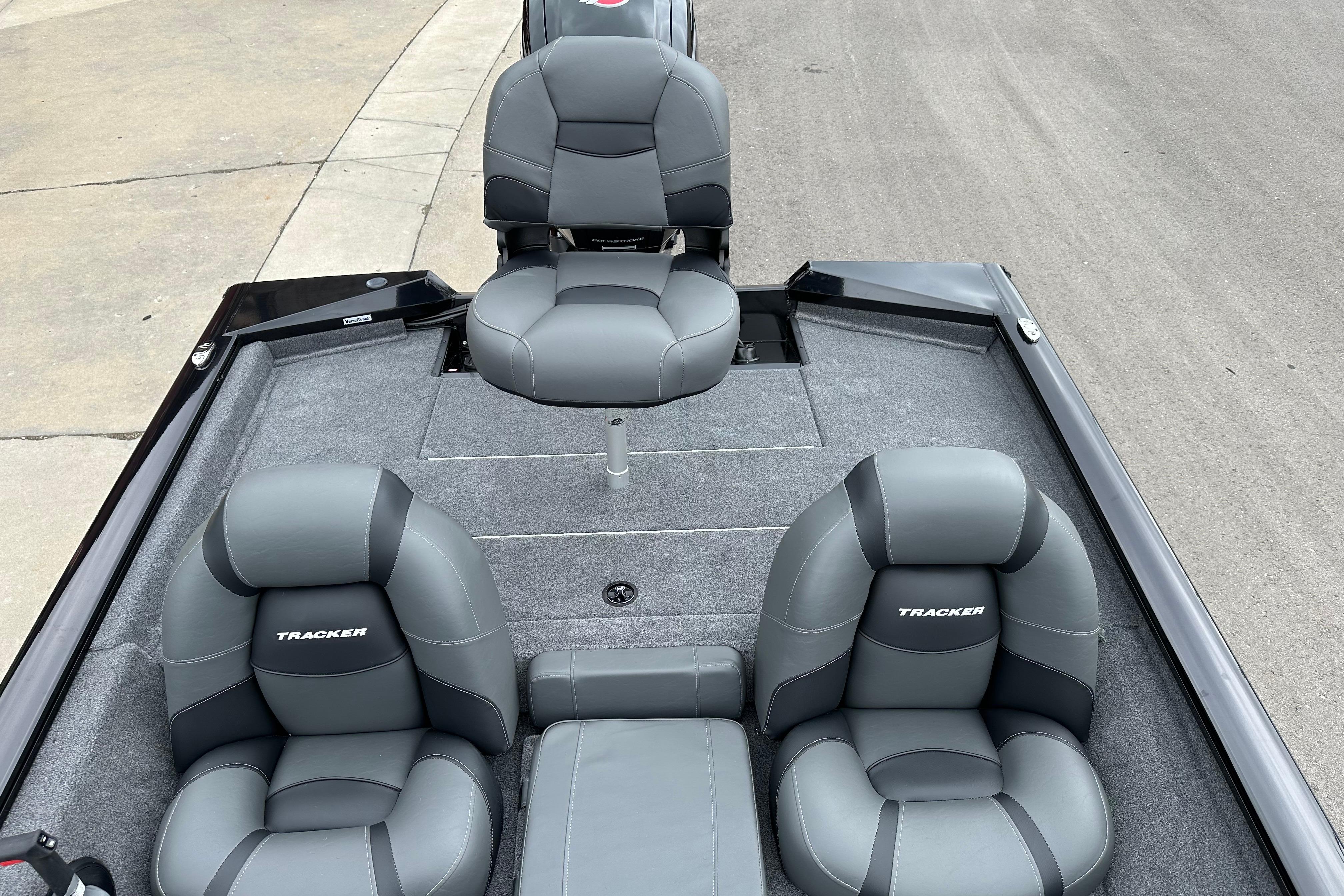 2026 Tracker Pro Team 190 boat interior with gray seating and carpeted deck.