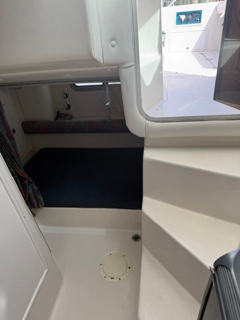 Interior of the 1995 Pro-Line 2950 Walkaround with seating area and stairs.