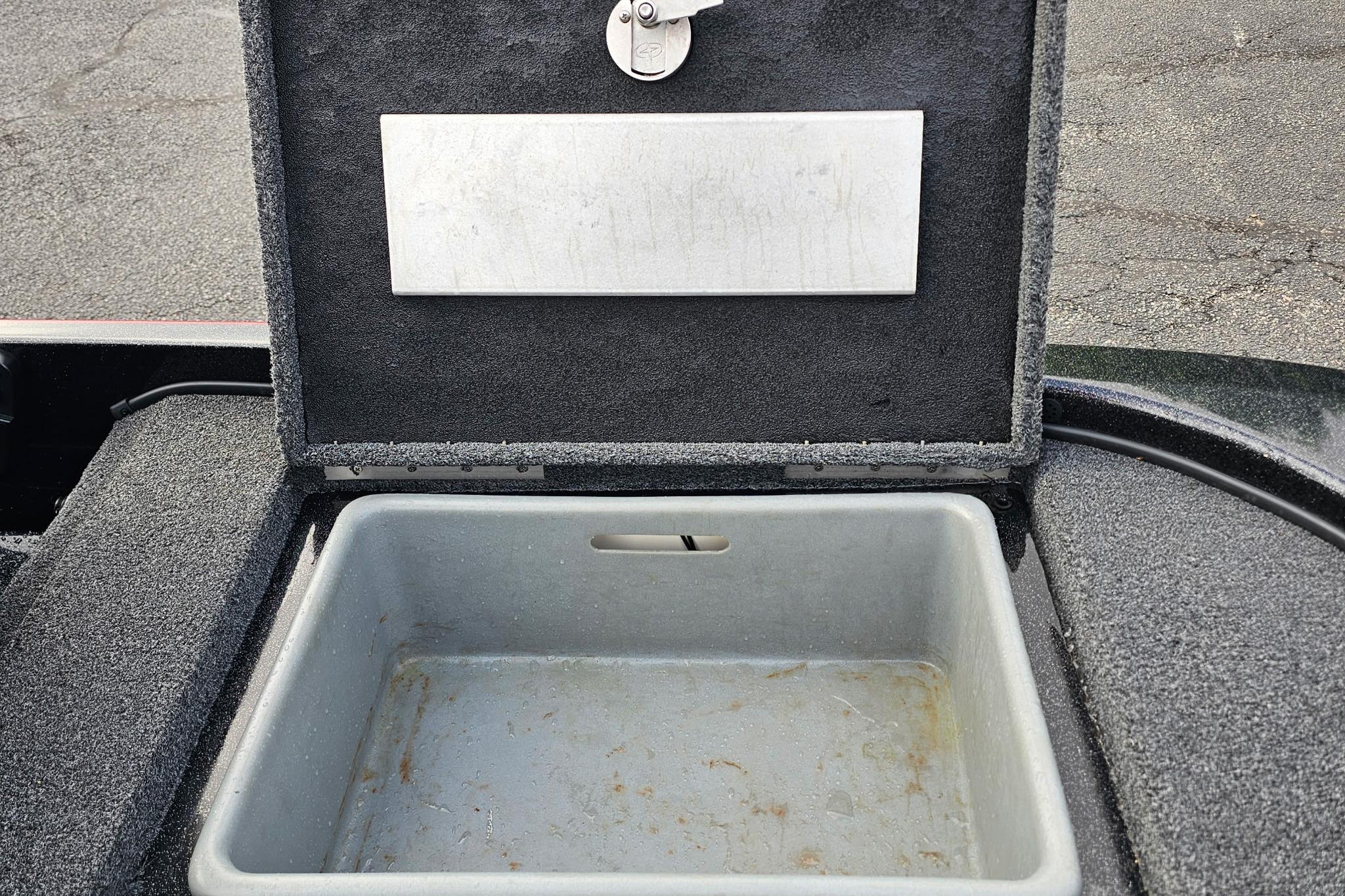 Open storage compartment in a 2017 Nitro Z20 Pro boat.