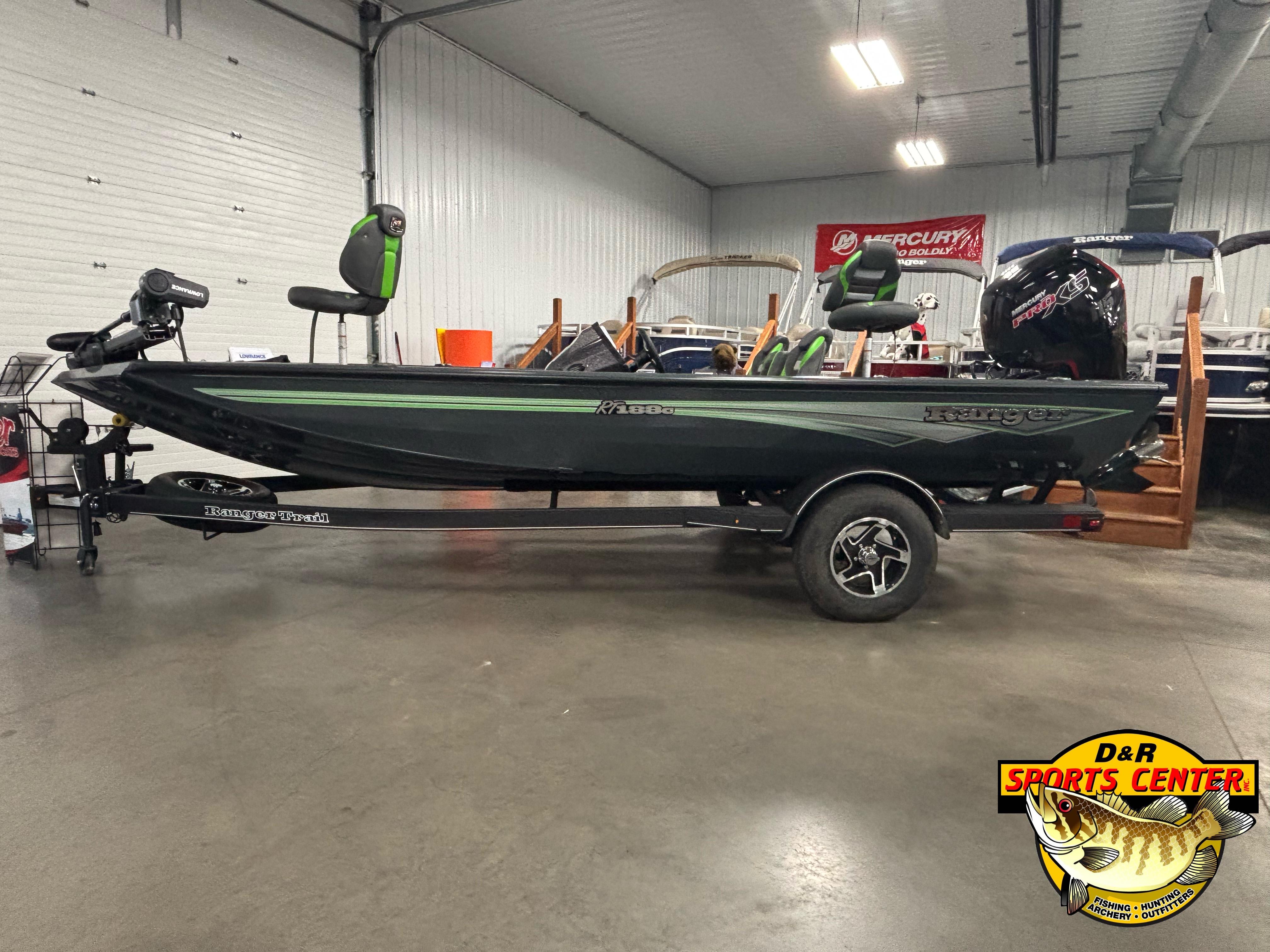 2025 Ranger RT188C fishing boat on trailer in showroom, featuring sleek design and modern equipment.