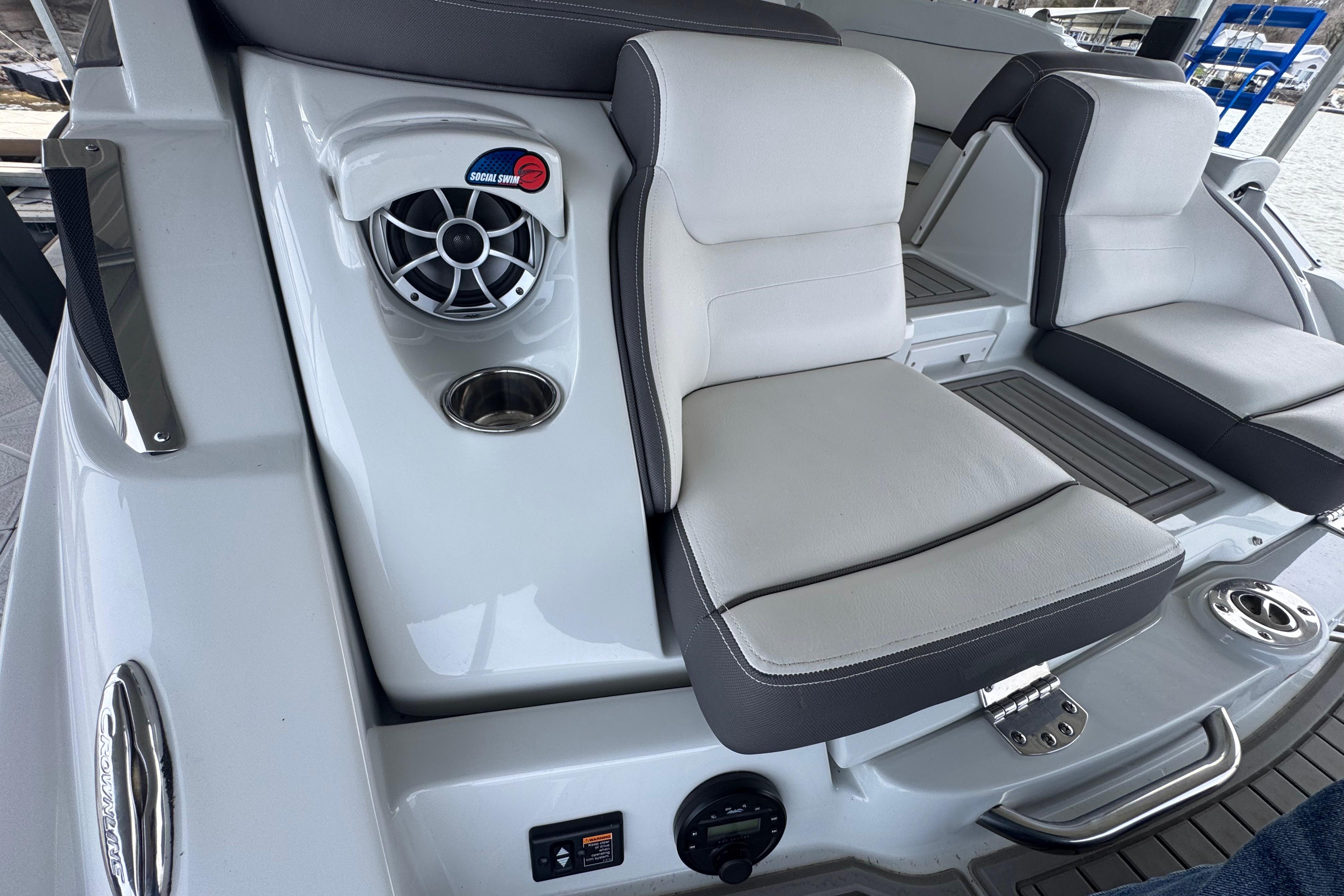 2022 Crownline 265 SS boat interior with cushioned seating and speaker system.