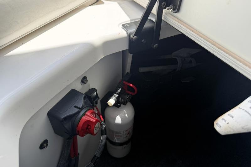 2017 Yamaha Boats SX210 interior with fire extinguisher and battery switch.