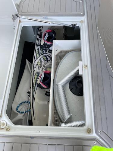 2019 Crownline E255 storage compartment with wakeboard and accessories.