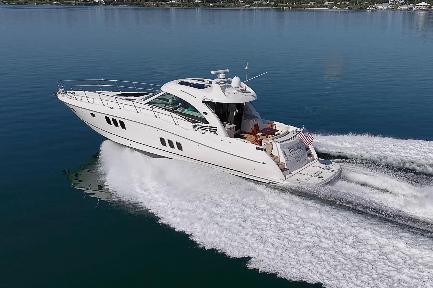 2008 Sea Ray 60 Sundancer yacht cruising on calm blue waters.