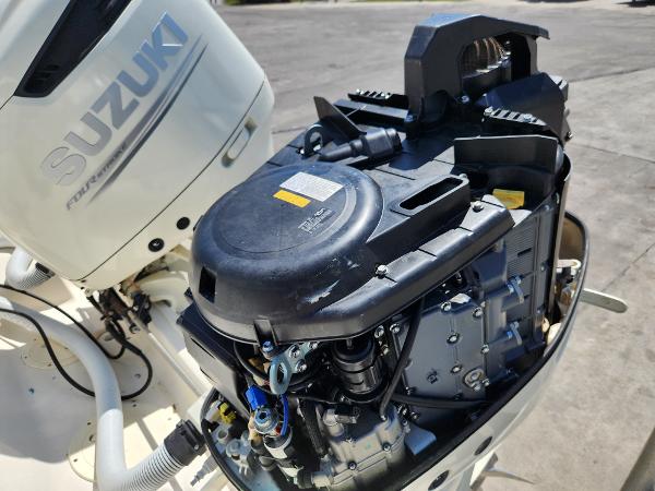 2005 Pursuit 3070 Offshore Center Console with Suzuki outboard engine, detailed view.