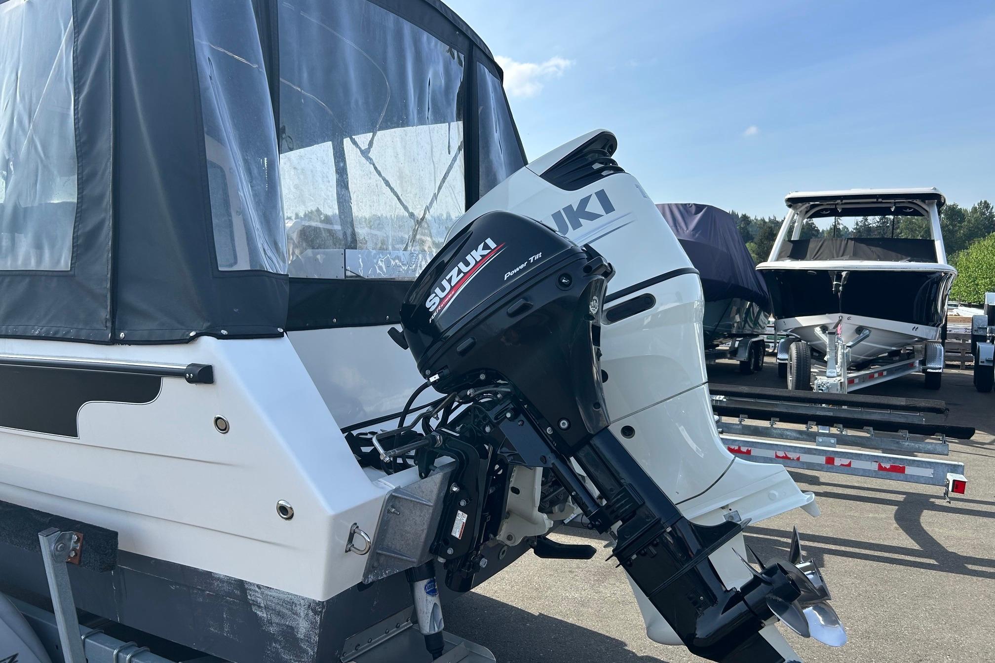 2018 C-Dory 23' Venture boat with Suzuki outboard motor on trailer.