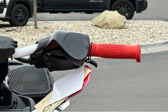 Close-up of a Sea-Doo PWC SPARK TRIXX 90 with a red handle.