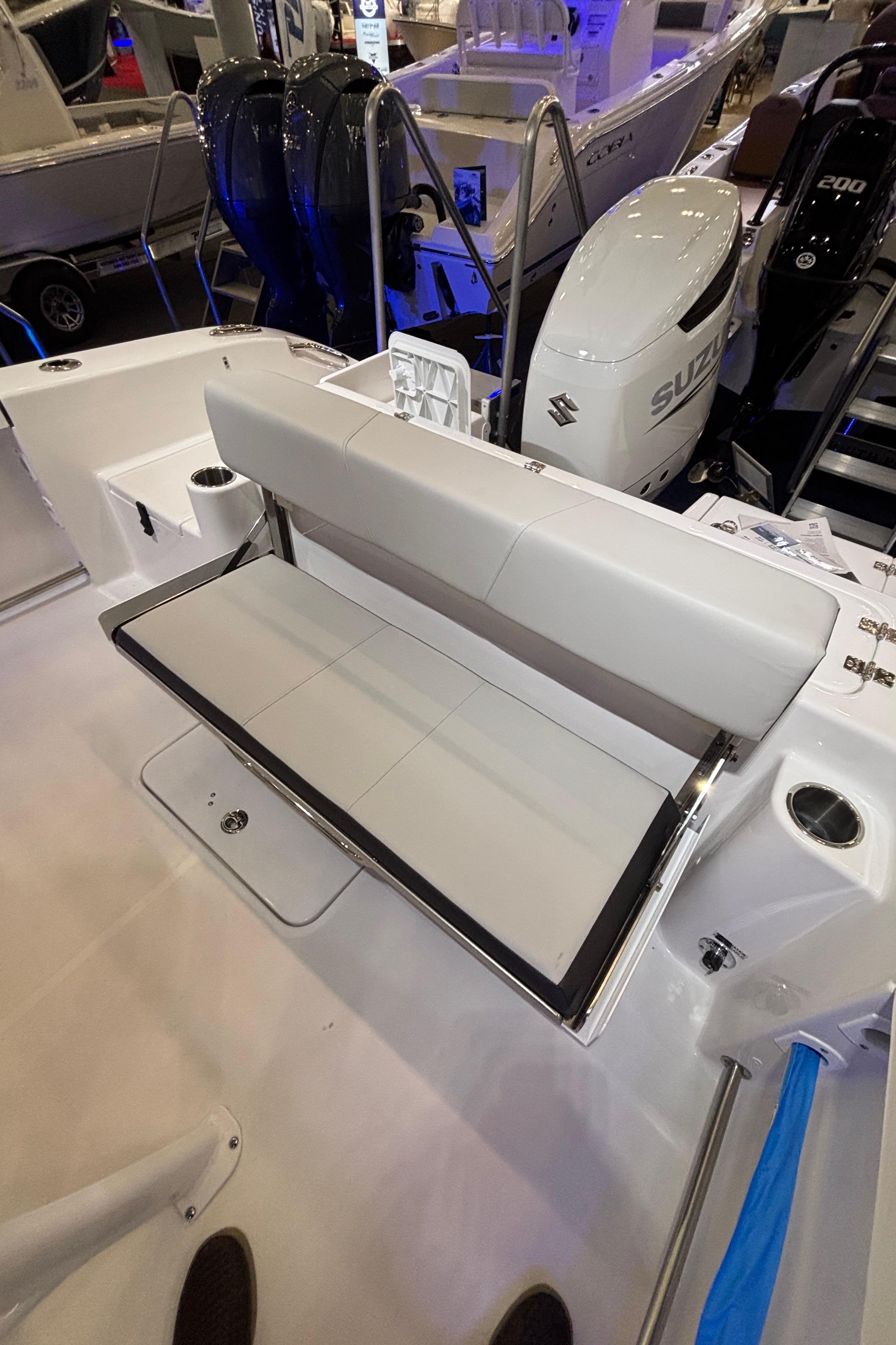2025 Sea Pro 242 Center Console boat interior with seating and Suzuki outboard motor.
