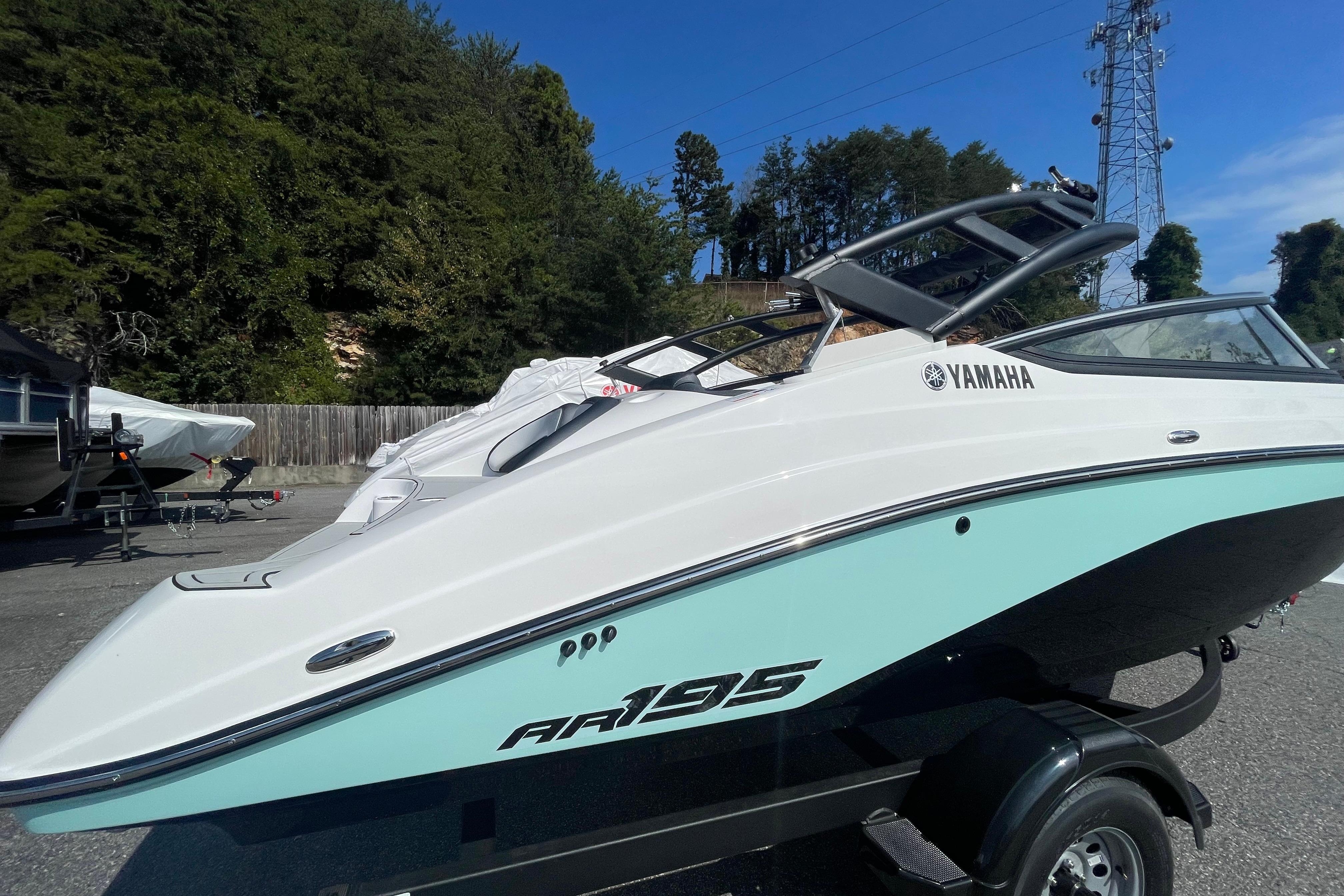 2026 Yamaha AR195 boat on trailer, sleek design, parked outdoors.