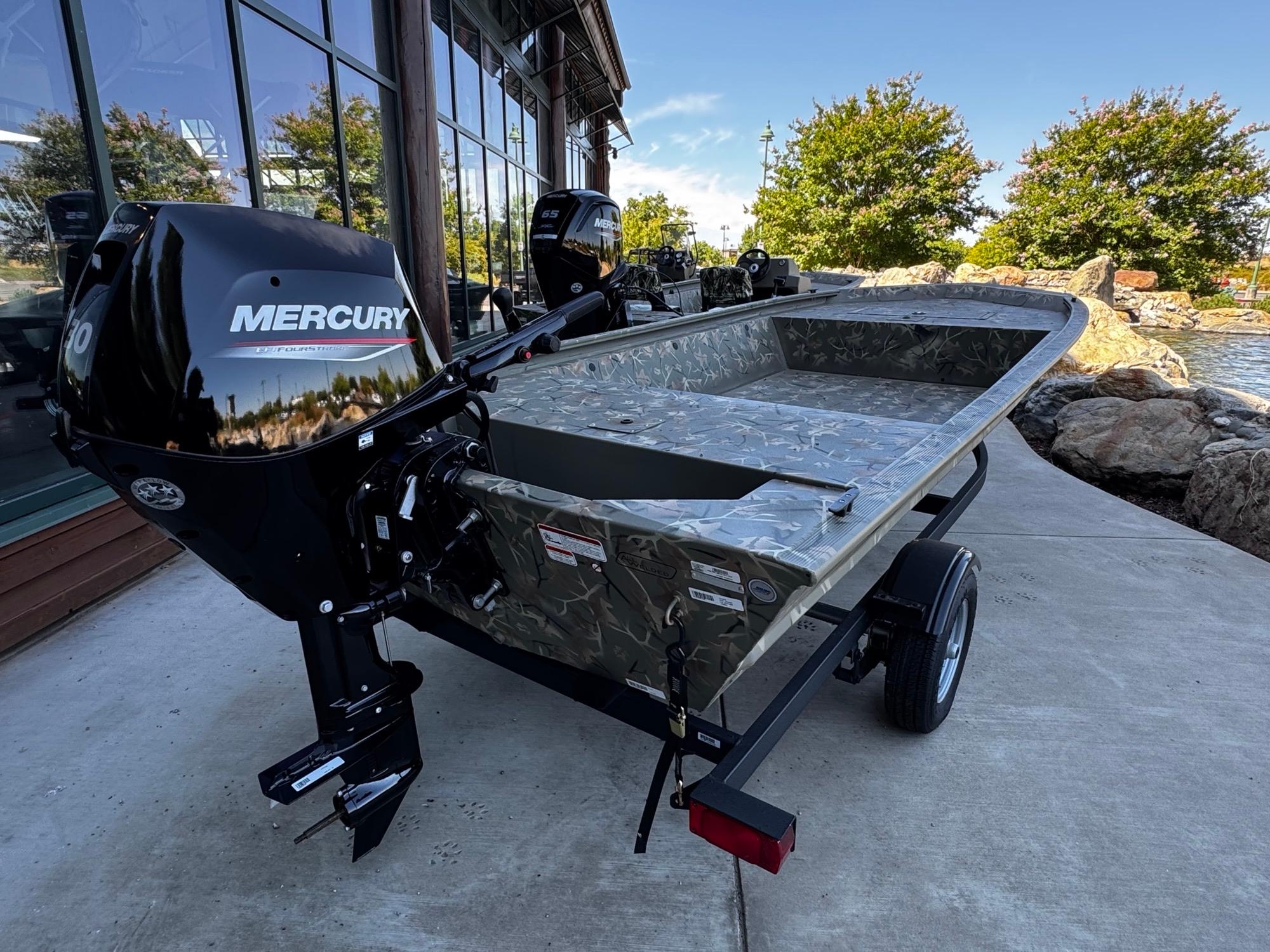 2025 Tracker Grizzly 1648 Jon boat with Mercury engine on a trailer.