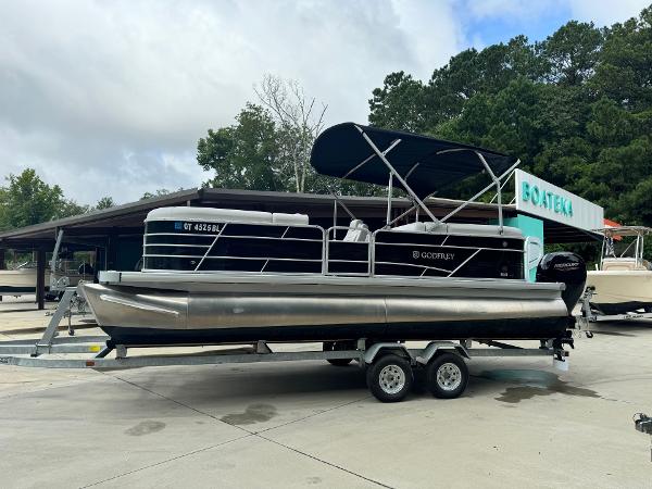 2023 Godfrey 2286 pontoon boat on a trailer at Boateka dealership.