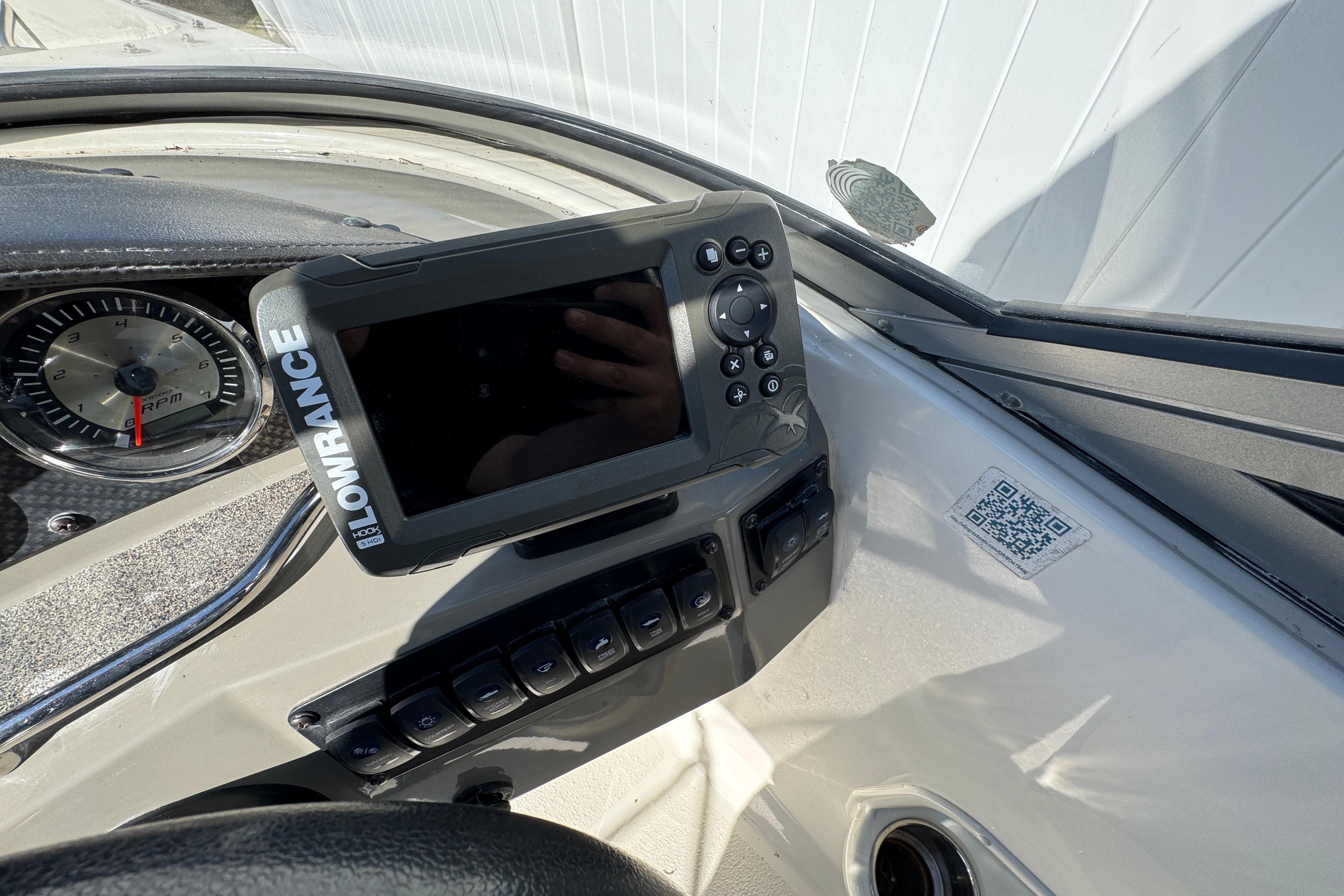 Dashboard of a 2018 Stingray 204 LR boat featuring a Lowrance GPS system.