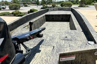 2025 Tracker Grizzly 1650 T Prairie Wings Edition boat with camouflage interior design.