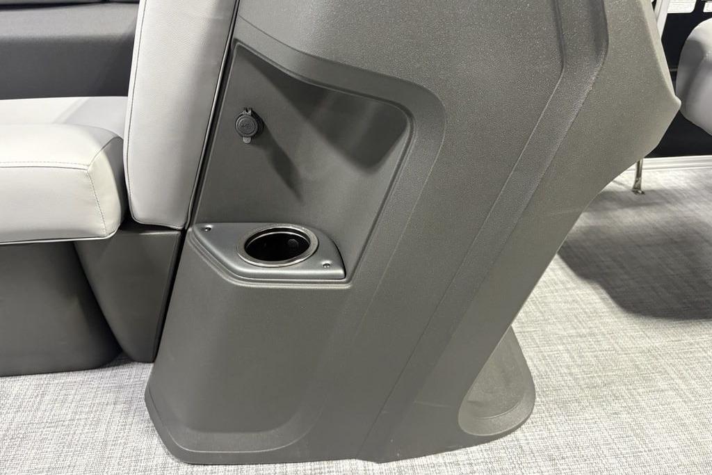 2026 Sun Tracker PARTY BARGE® 20 DLX interior with cup holder and seating detail.