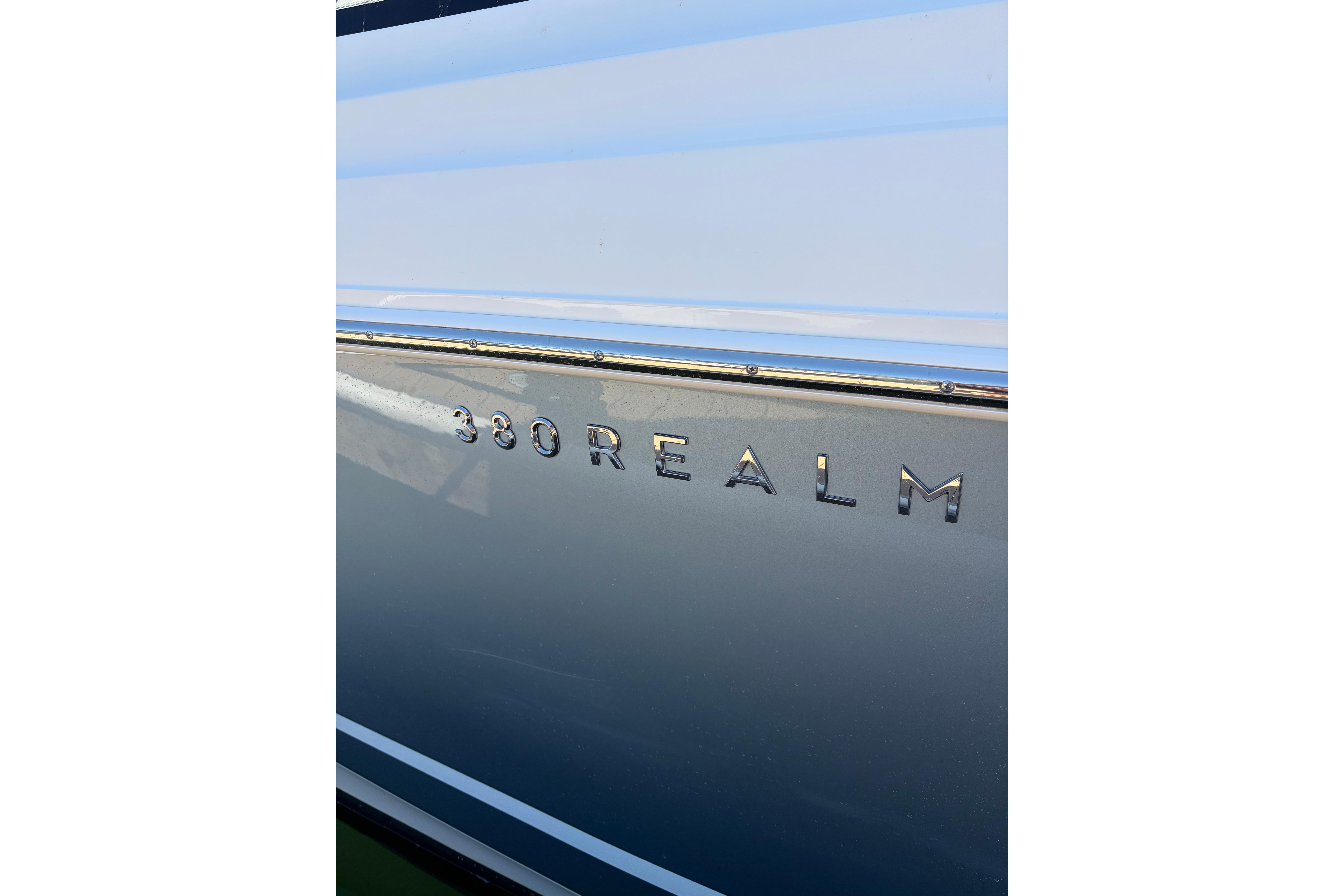 2020 Boston Whaler 380 Realm boat nameplate on sleek hull.