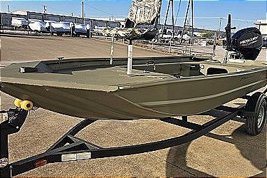 2025 Tracker Grizzly 1654 T Sportsman boat on trailer, outdoor setting.