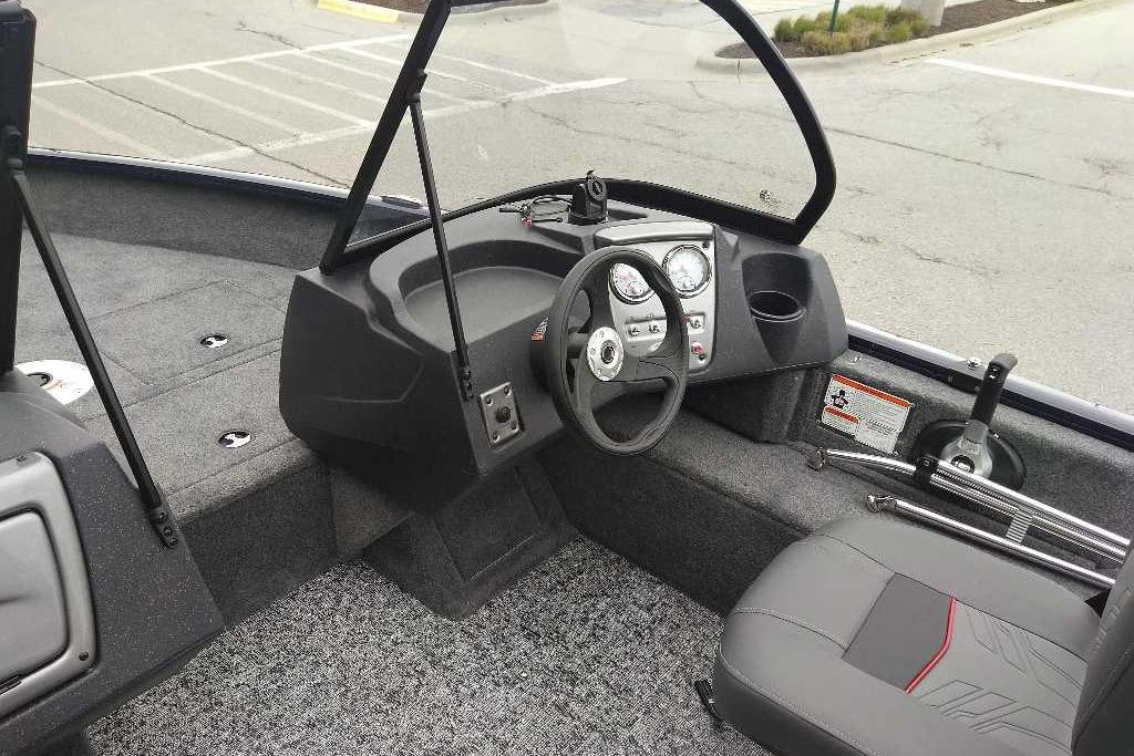 2026 Tracker Pro Guide V-16 WT boat interior with steering wheel and dashboard controls.