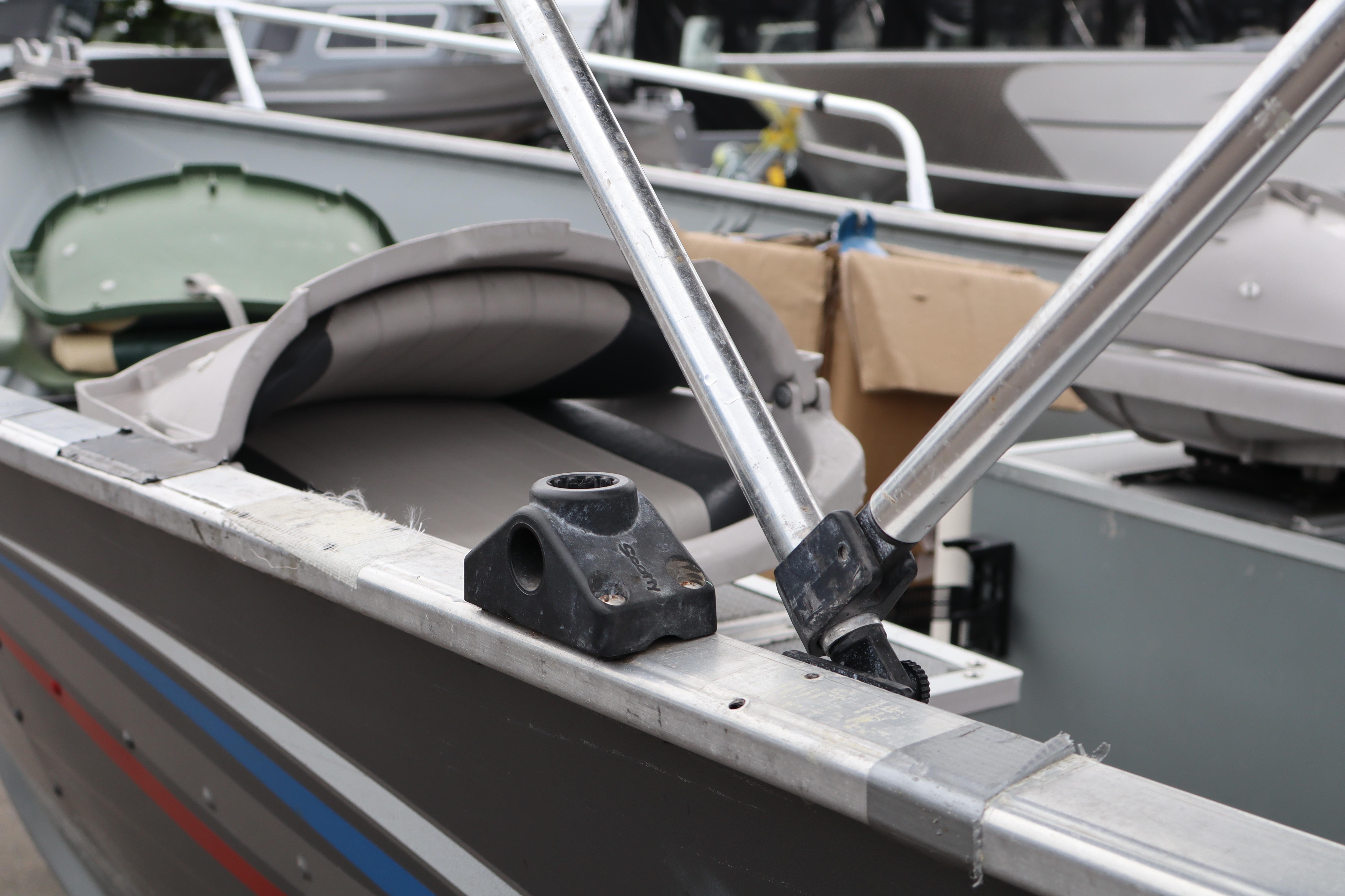 2006 Smoker Craft Alaskan 15 boat interior with folded seats and metal framework.