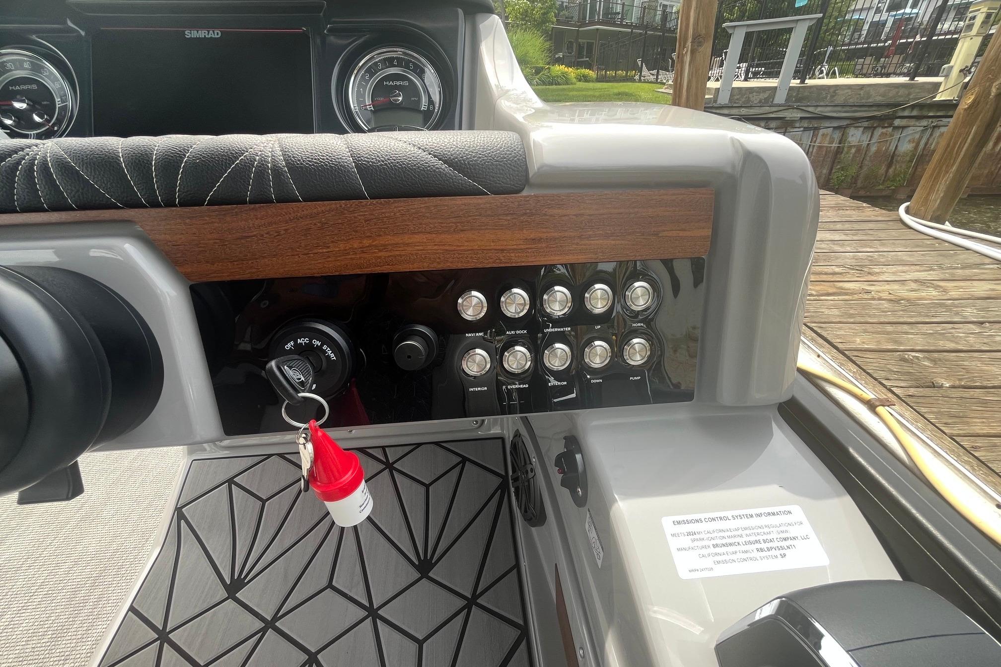 2024 Harris Grand Mariner 250 dashboard with controls and ignition key.