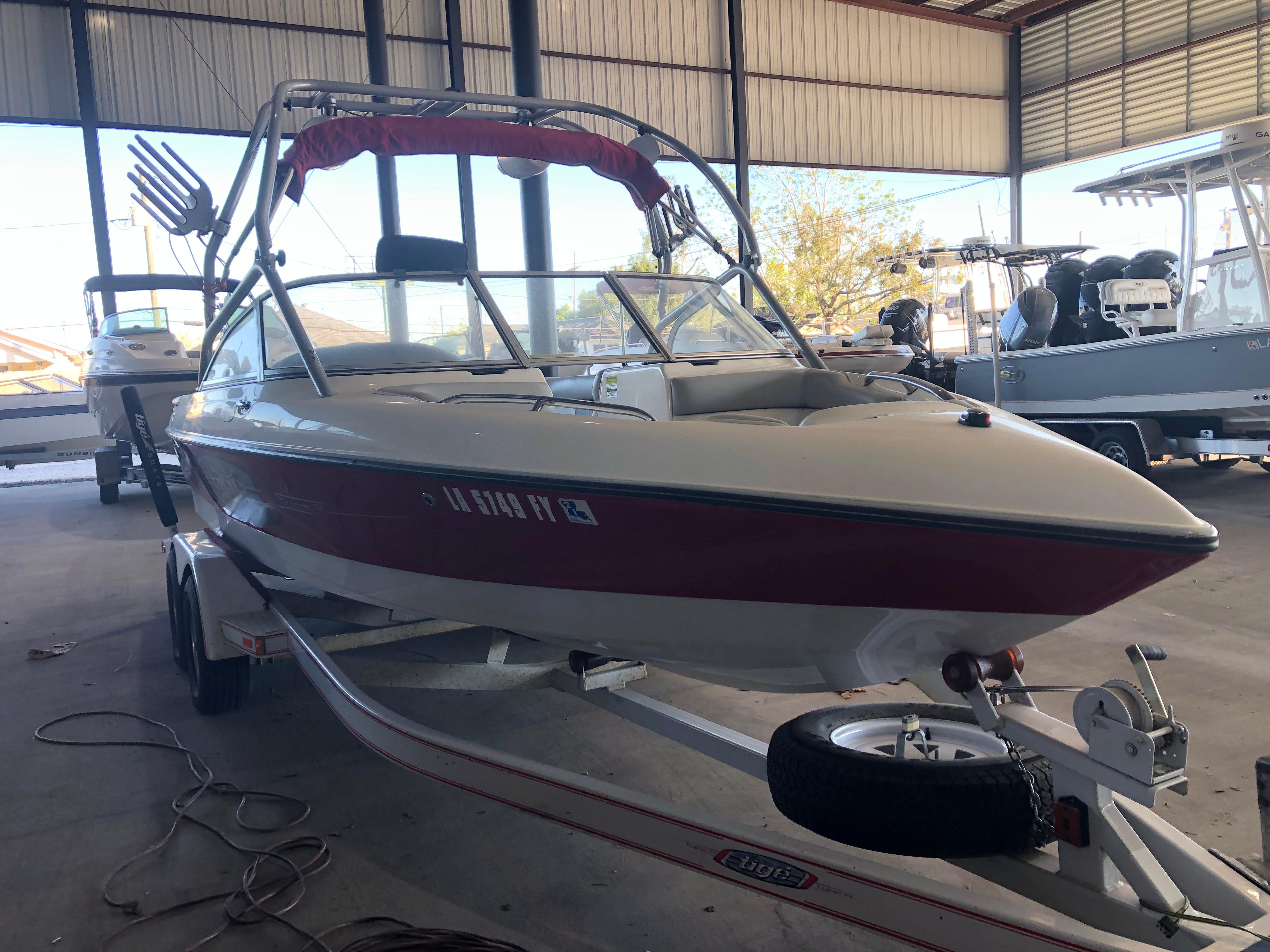 2004 Tigé 22I TYPE R boat on trailer in storage facility.