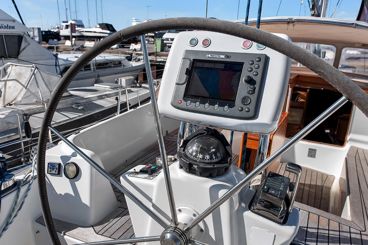 Steering wheel and navigation equipment on a 2007 Nordship 40 DS sailboat.