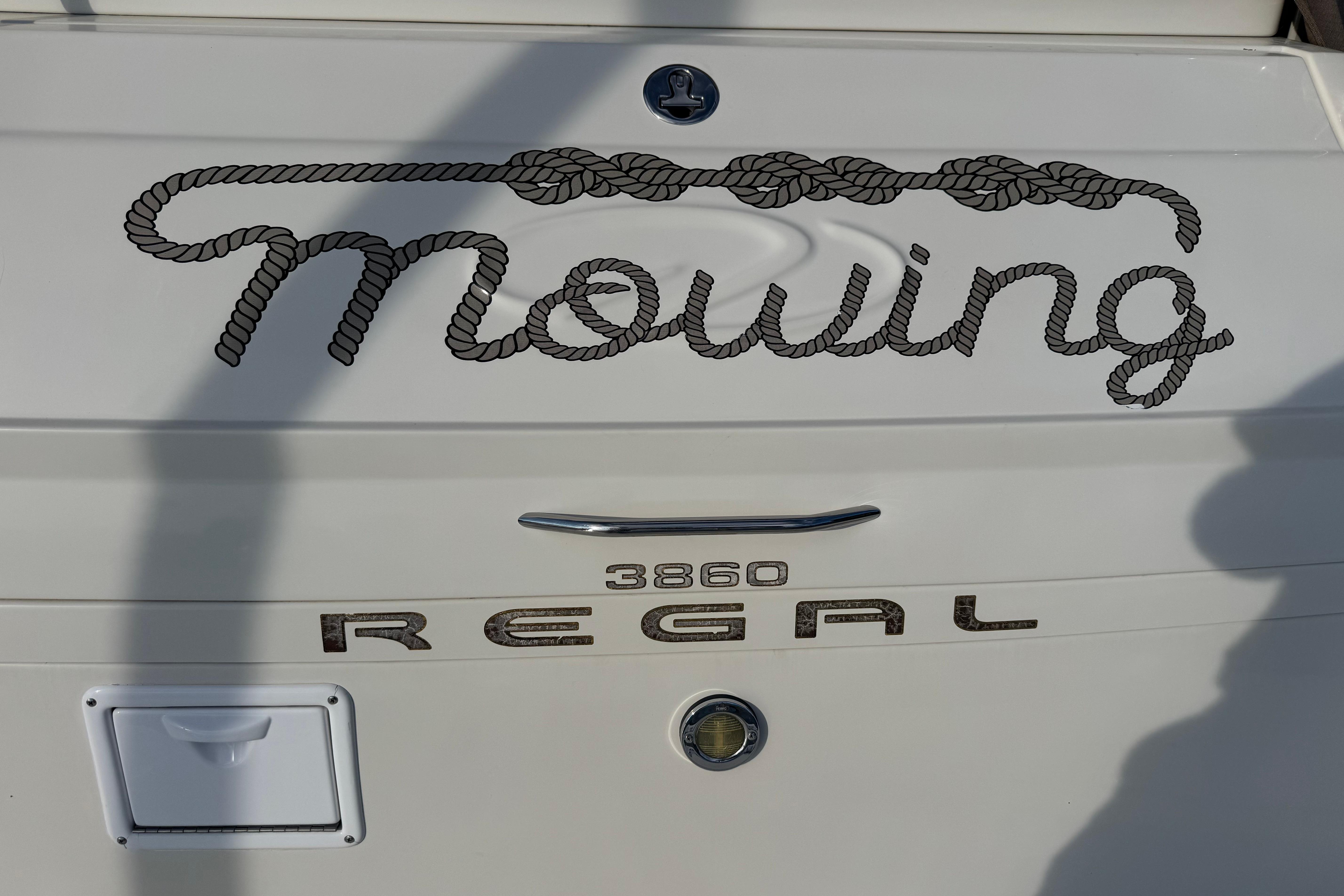 2007 Regal Commodore 3860 boat with "Mowing" rope design on the stern.