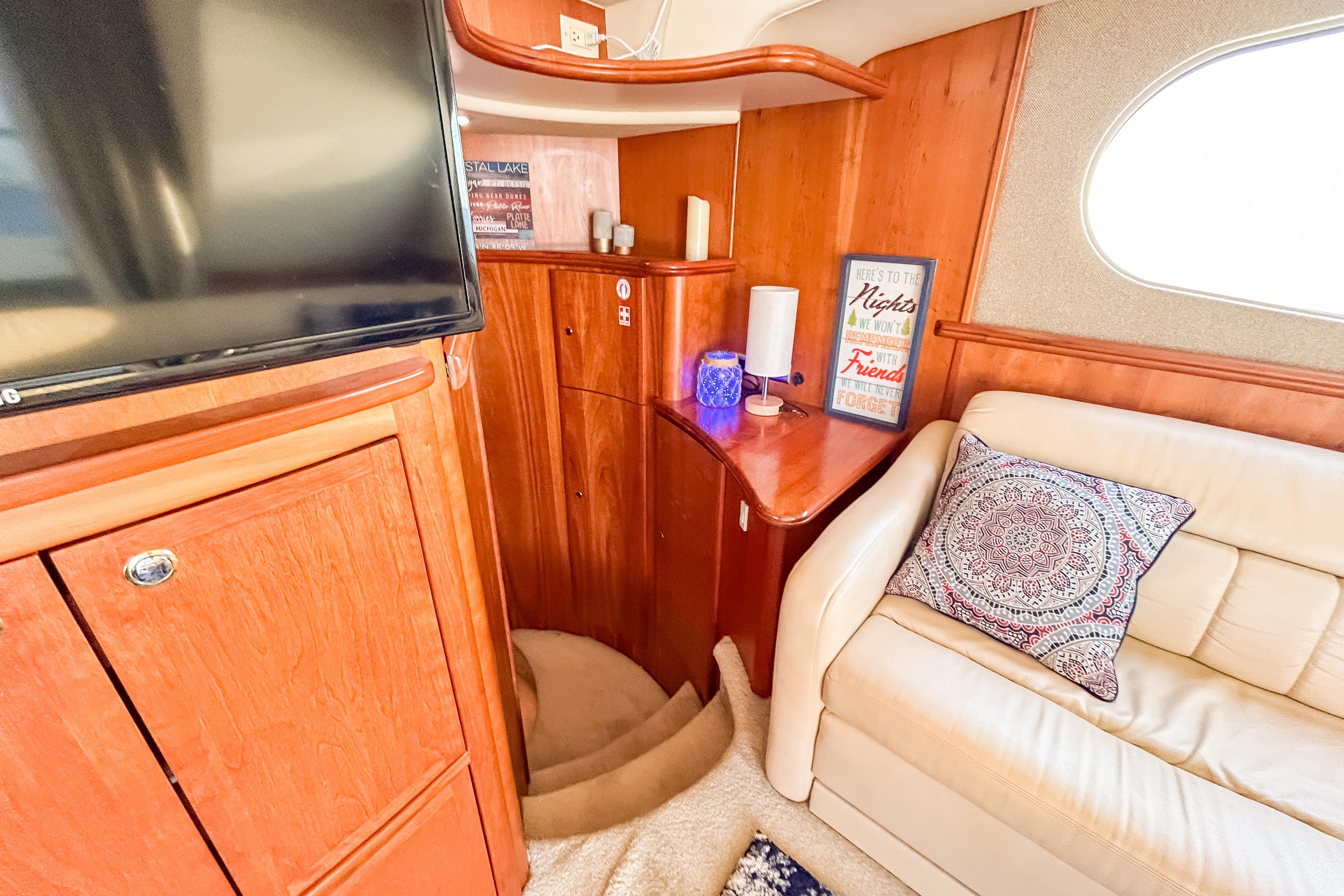 Luxurious interior of 2003 Silverton 410 Sport Bridge with cozy seating and elegant wood finishes.