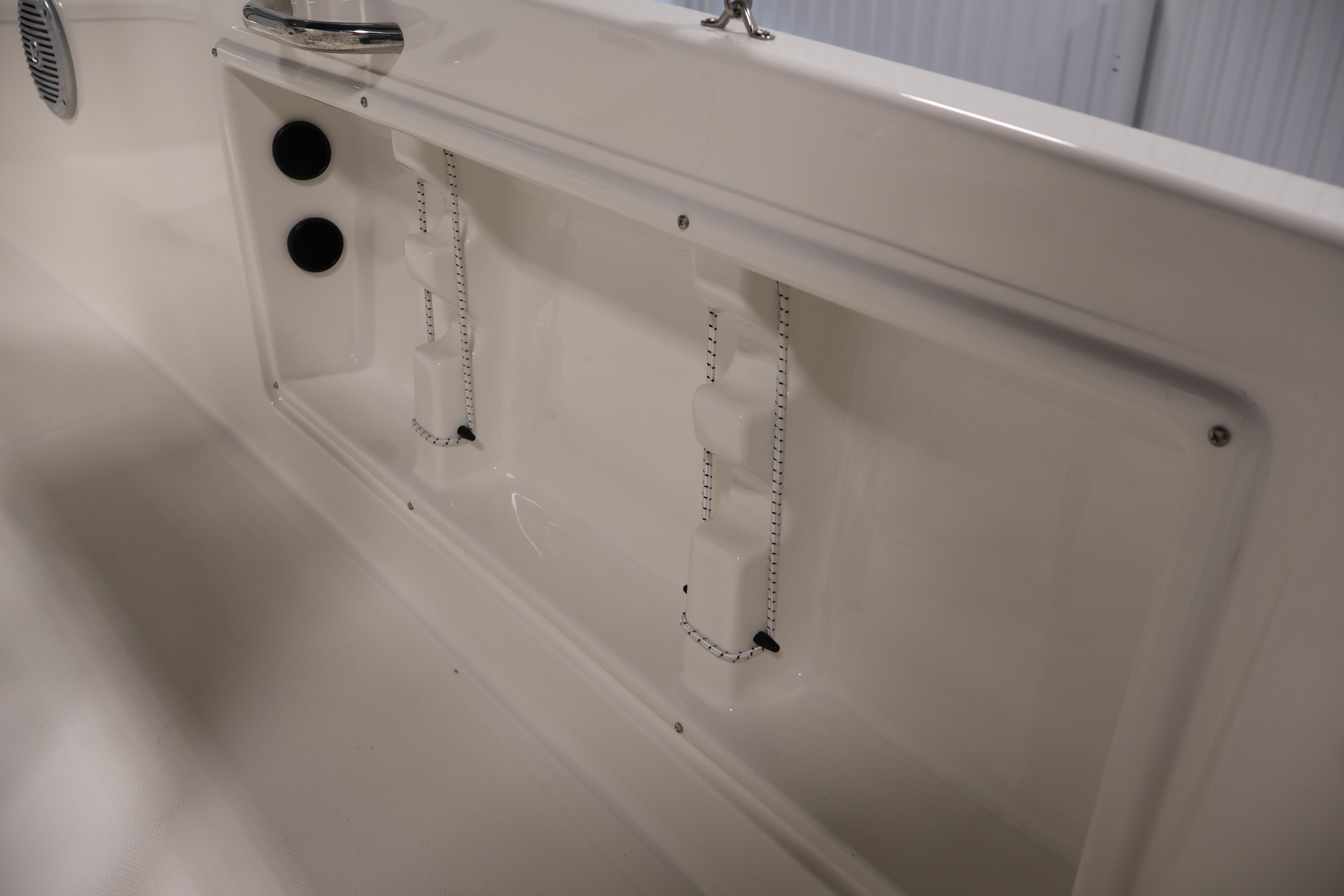 2026 Bayliner Trophy T18 boat interior detail with storage compartment and fixtures.