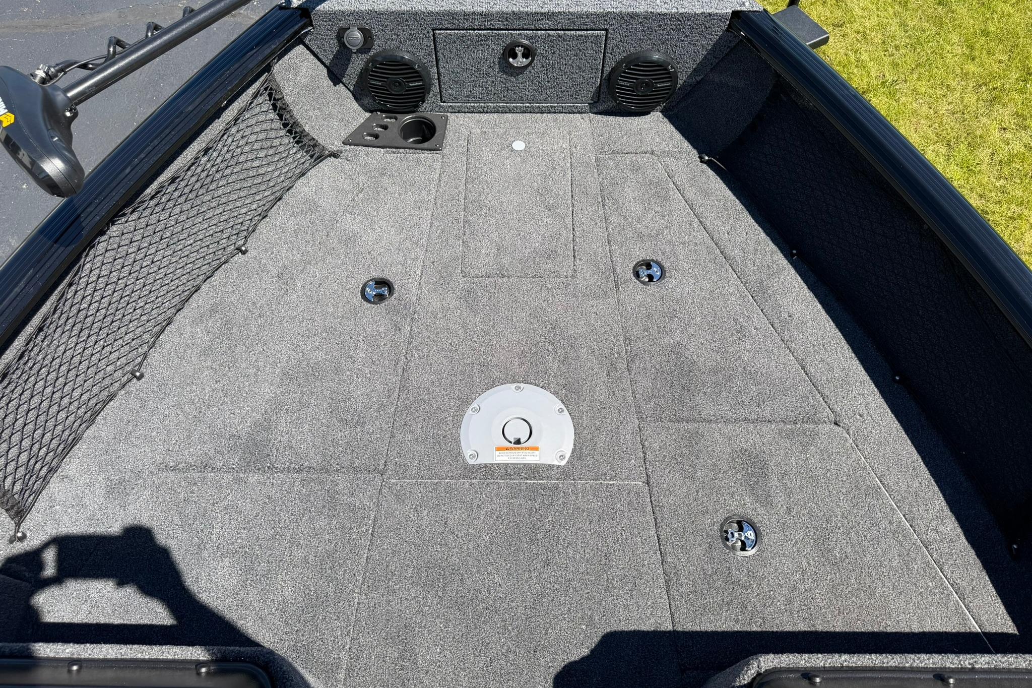 2027 Lund 1775 Impact XS Sport boat deck with carpeted surface and storage compartments.