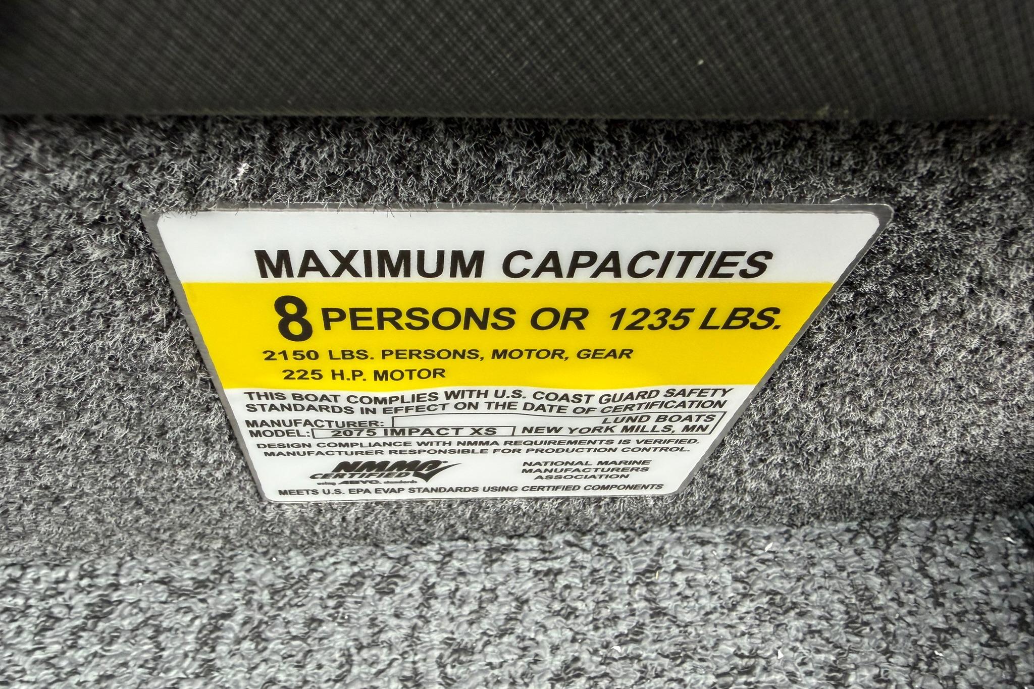 2027 Lund 2075 Impact XS capacity label: 8 persons or 1235 lbs, 225 HP motor.