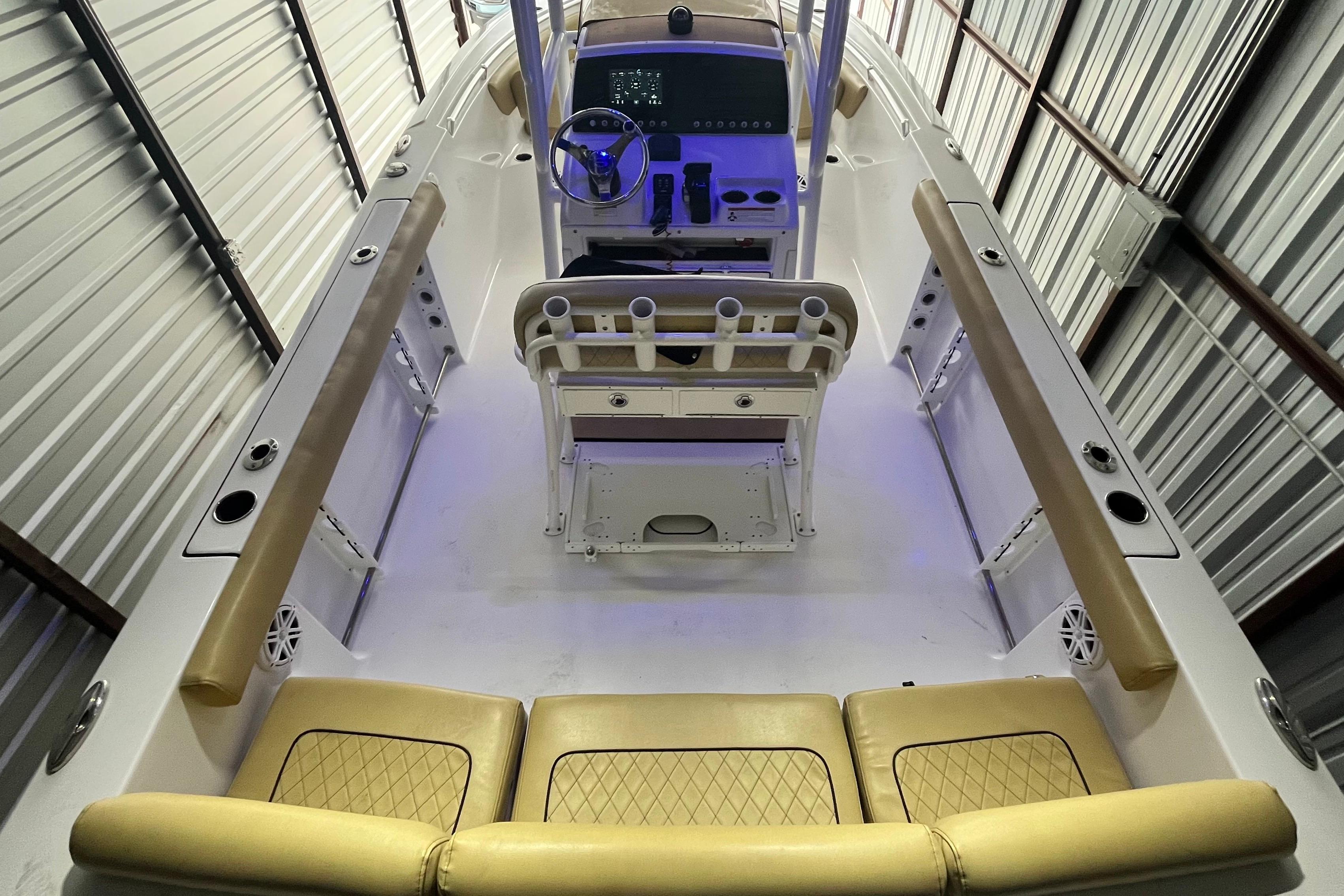 2021 Sportsman Heritage 231 Center Console boat interior with tan seating and modern controls.