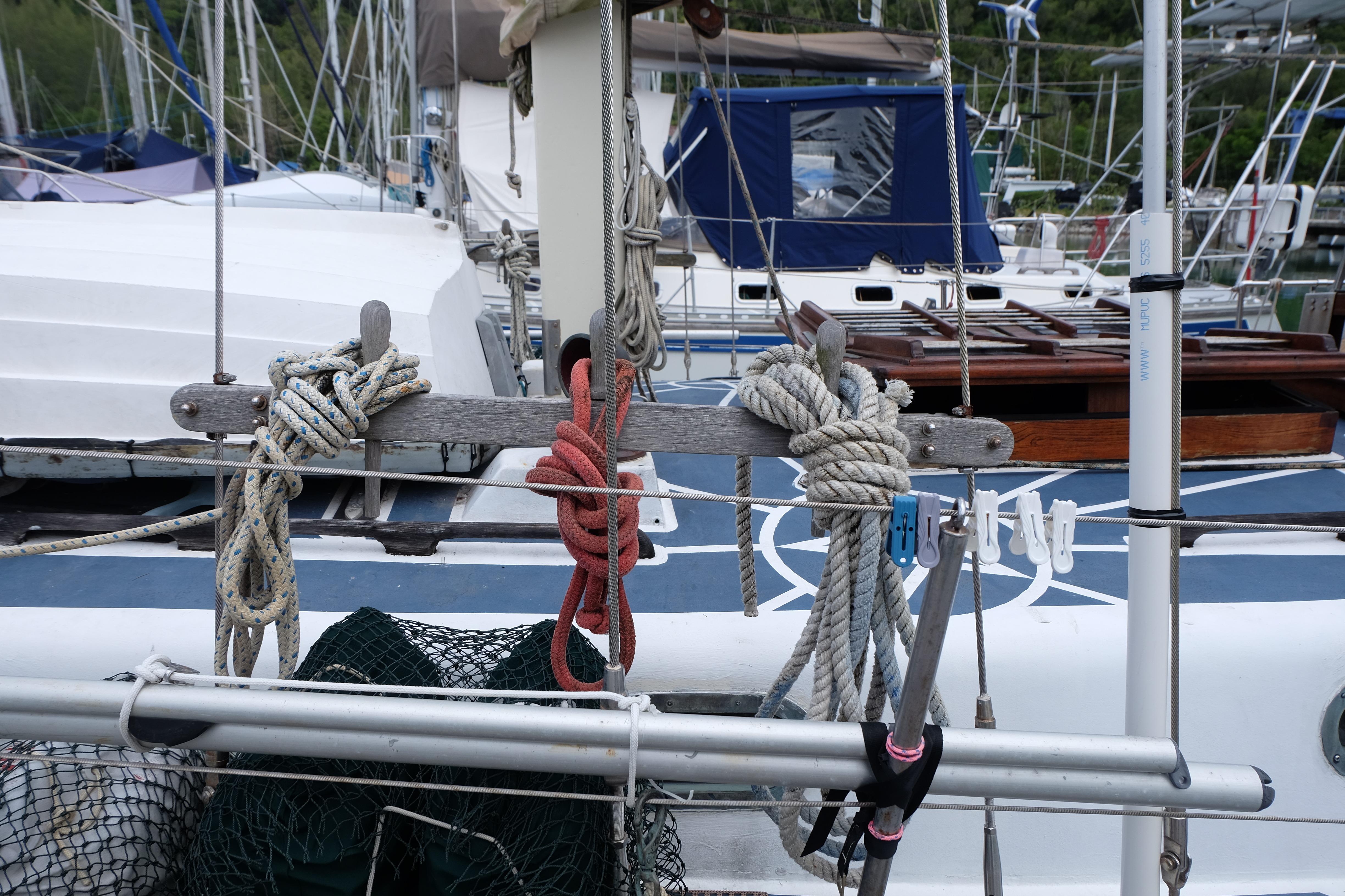 Sailboat deck with ropes and equipment, Westwind 35, 1979 model, docked in a marina.