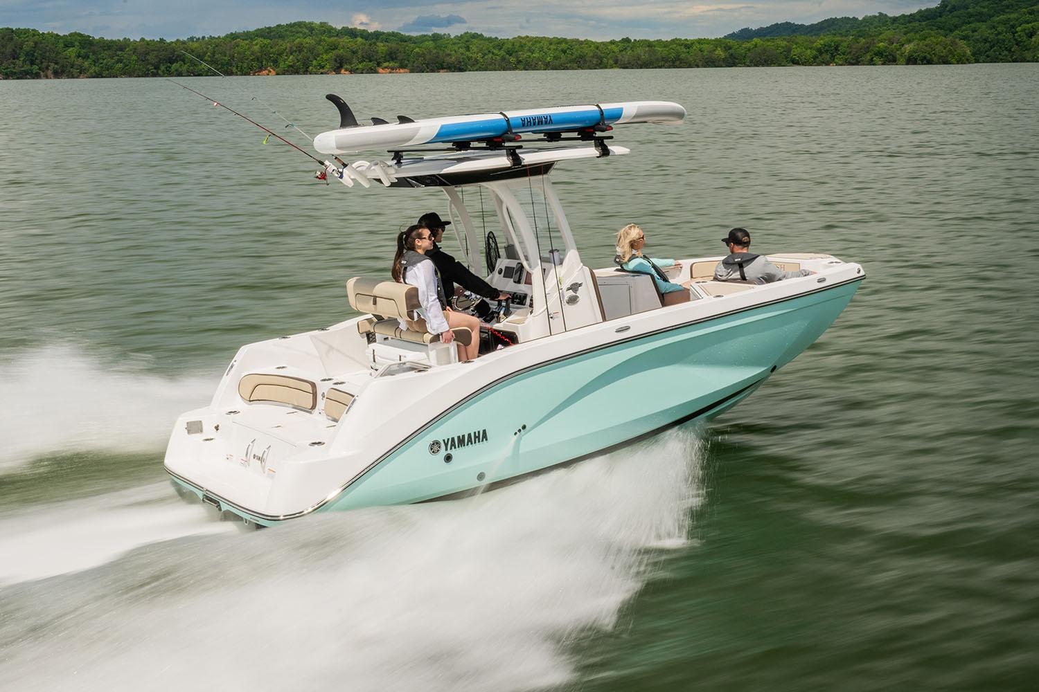 Manufacturer Provided Image: 2026 Yamaha Boats 222 FSH Sport E cruising on a lake with passengers onboard.