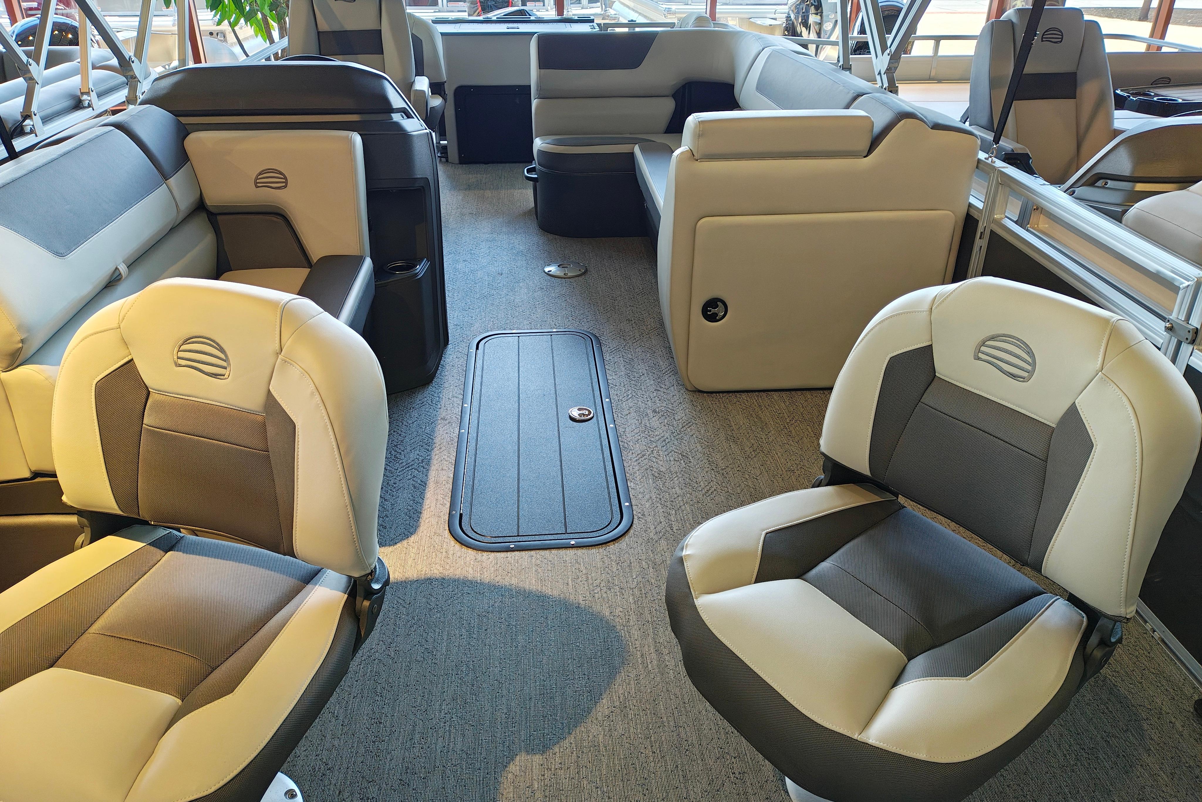 Interior of 2026 Sun Tracker Fishin' Barge 22 XP3 with comfortable seating.