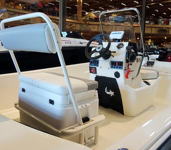 2023 Mako Pro Skiff 17 CC center console boat interior with seating and steering wheel.