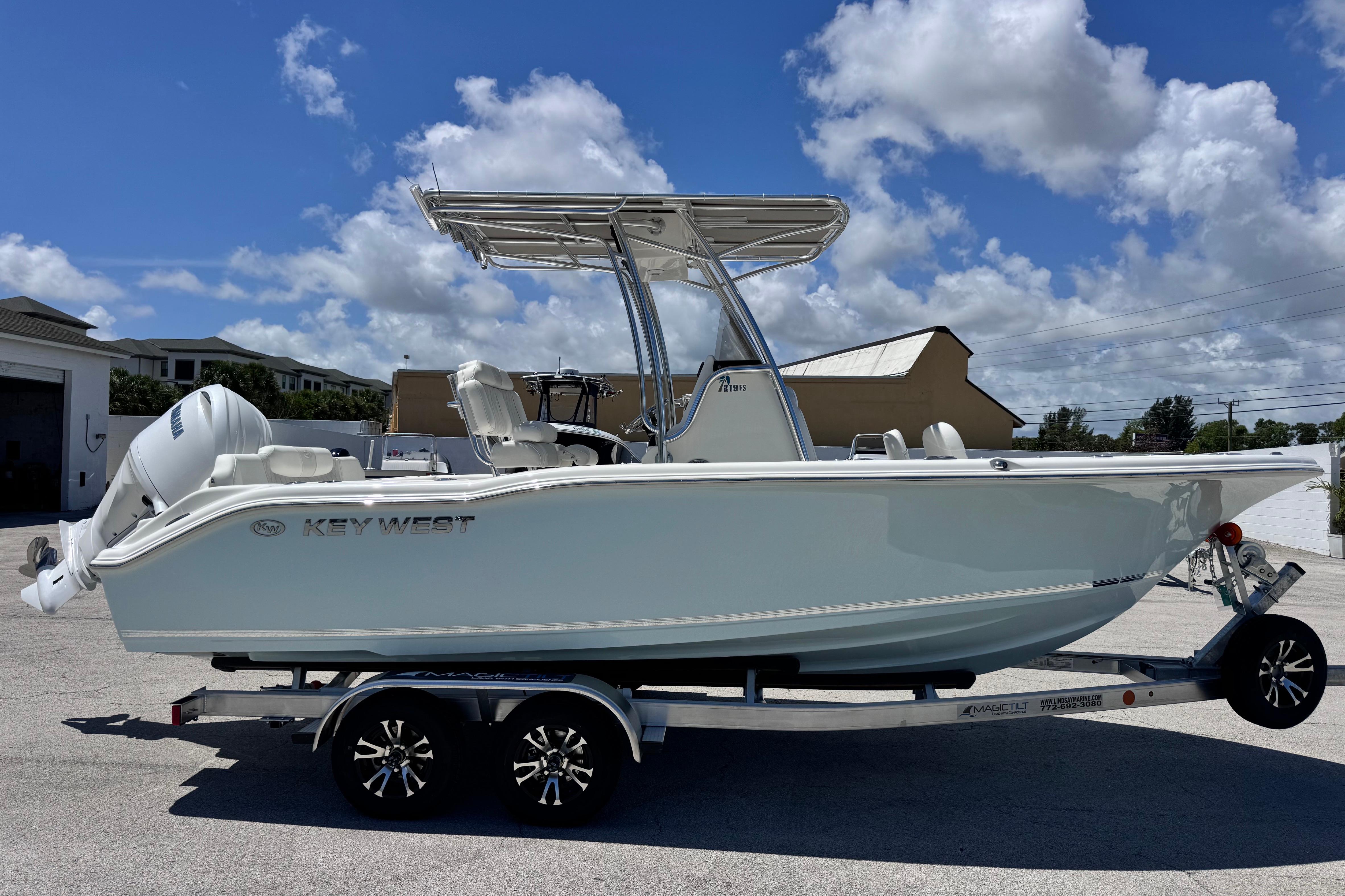 2026 Key West 219 FS boat on trailer under clear blue sky.