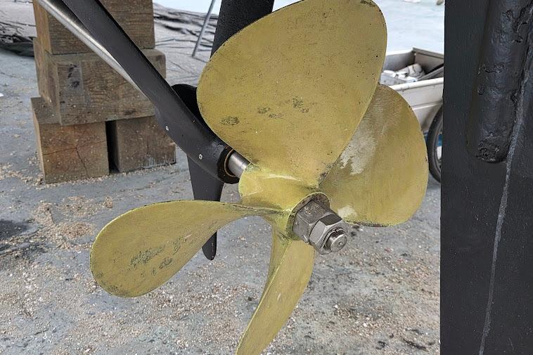 Propeller of 1993 McKinna 48 Pilothouse boat on dry dock.