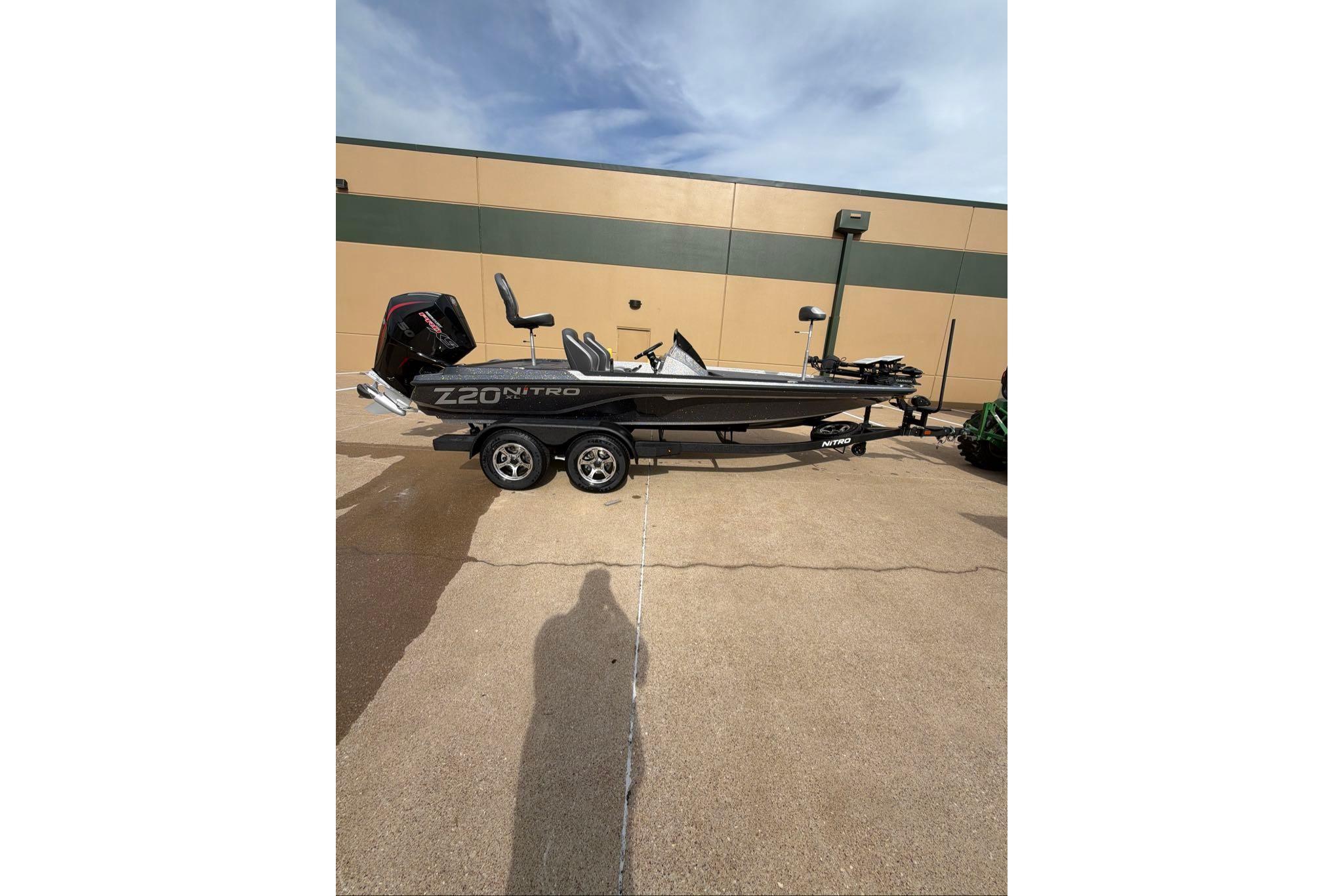 2026 Nitro Z20 XL boat on trailer, parked outdoors.