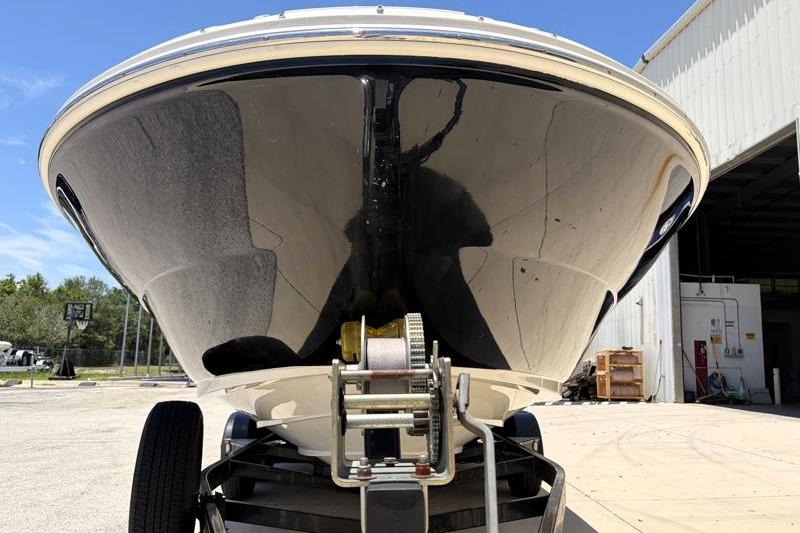 2007 Sea Ray 240 Sundeck boat on trailer, front view, outdoors.