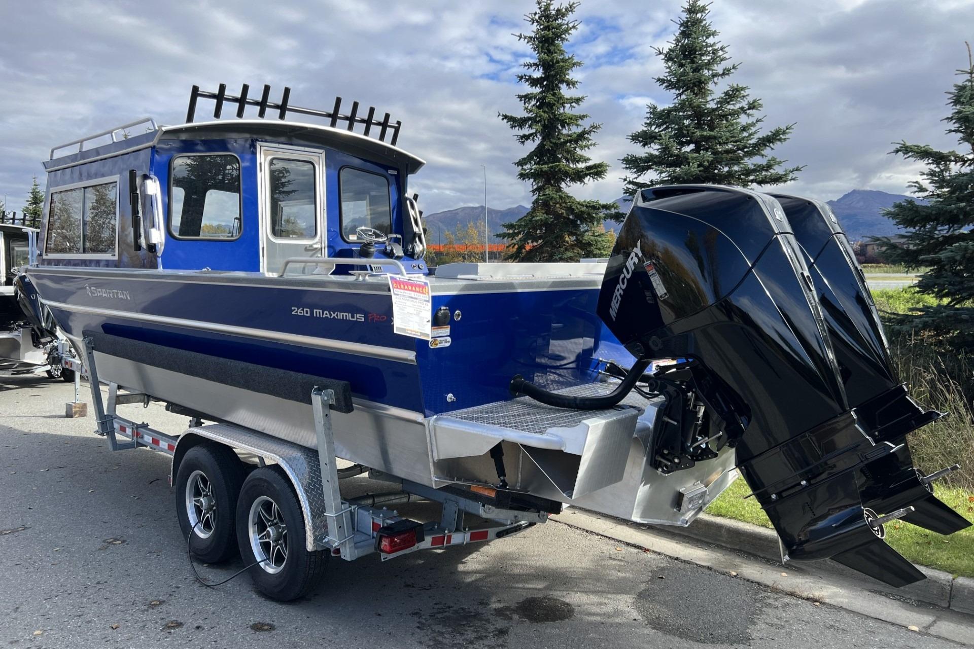 2024 Spartan 26 Maximus Pro XL boat on trailer, featuring dual outboard motors.