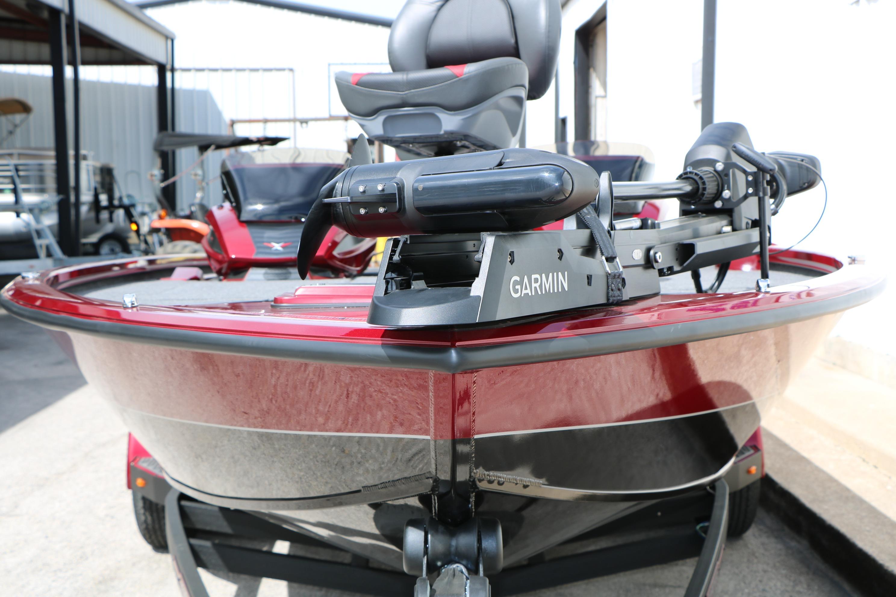 2026 Vexus AVX 1985s boat with Garmin equipment, red exterior, parked outdoors.