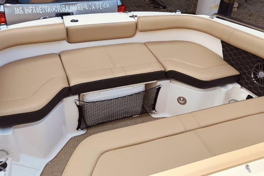 2022 Sea Ray SDX 250 boat interior with tan seating and storage net.