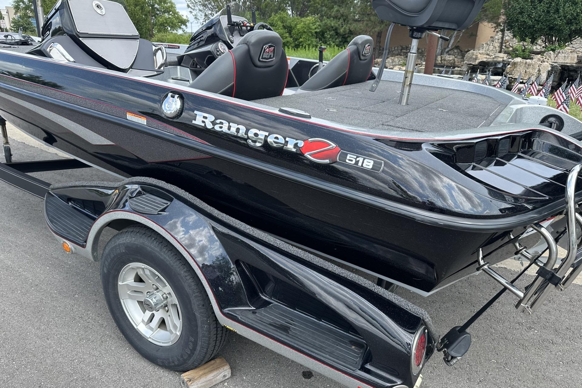 2018 Ranger Z518 boat on trailer, sleek black design with red accents.